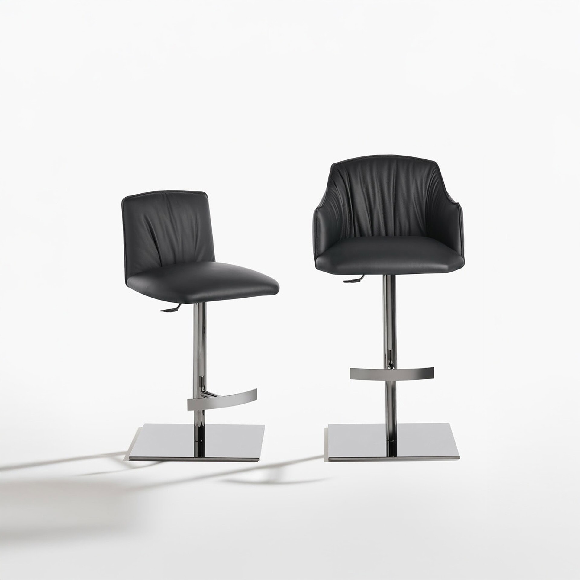Two Blossom stools with square pedestal bases and quilted upholstered backs, displayed on a white background.