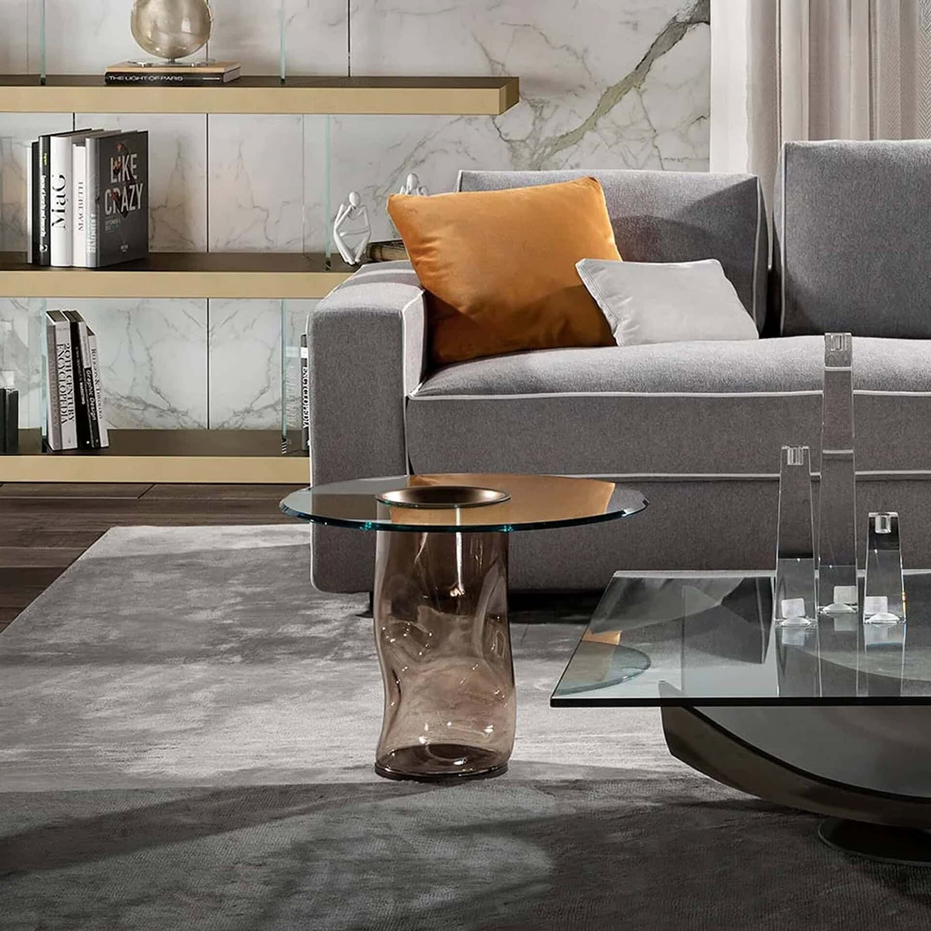 Dandolo 40 Side Table with bronze Murano glass base and clear glass top styled in a modern living room.