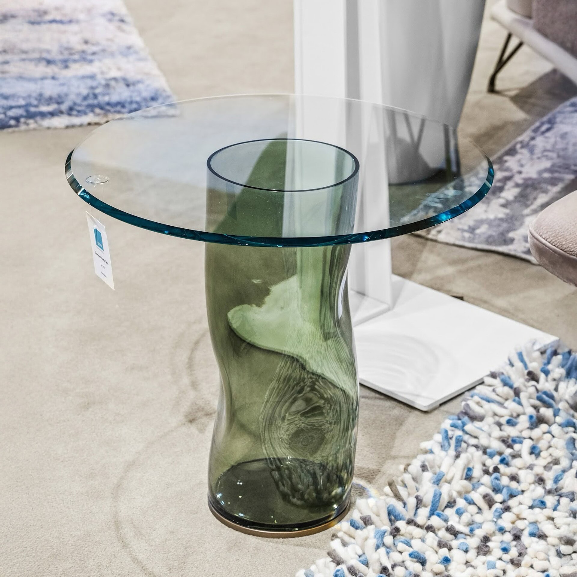 Elegant glass and green resin side table with modern design, perfect for contemporary living rooms.