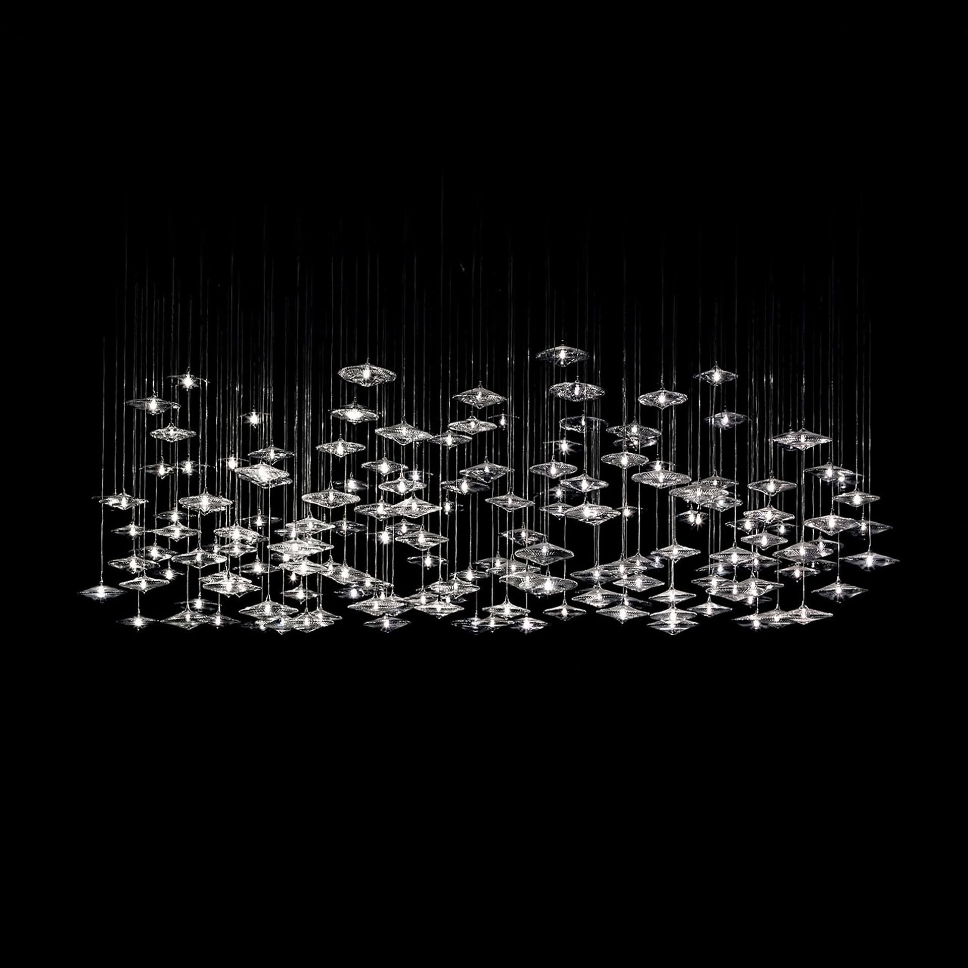 Sirius Modern Glass Chandelier arranged in a wide, constellation-like pattern over a large space.