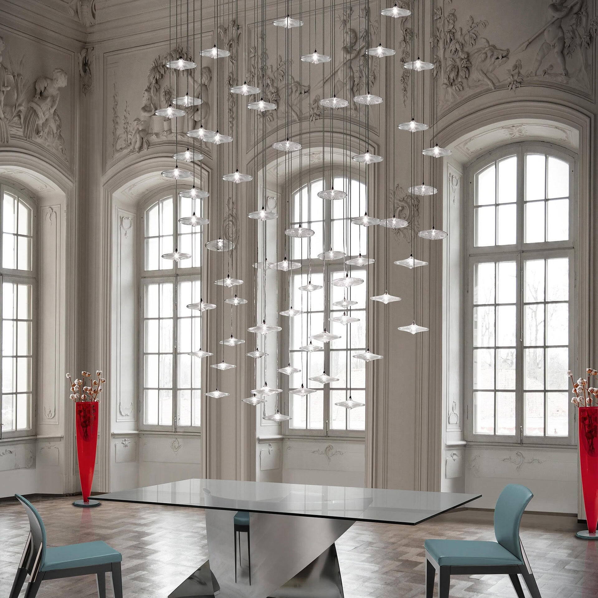 Large Sirius Modern Glass Chandelier with multiple disks suspended in a grand high-ceiling room.