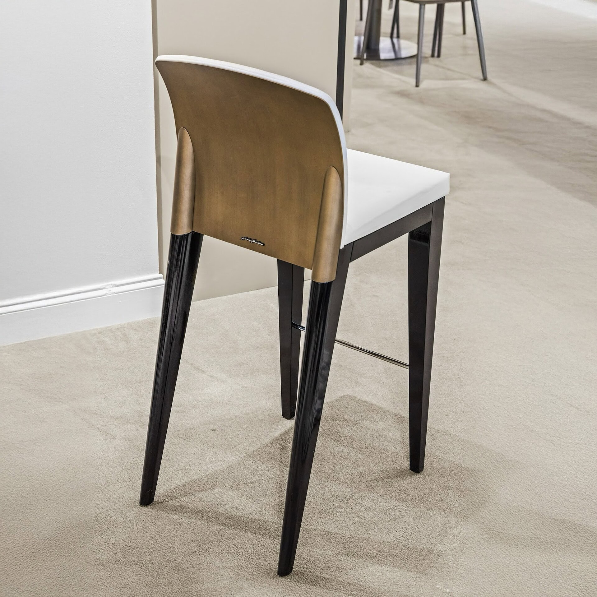 Wood and black metal dining chair with white cushioned seat at Sklar Furnishings.