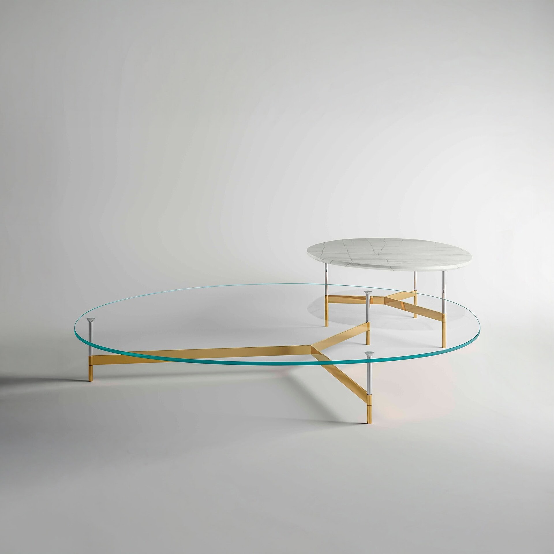 Contemporary glass and marble coffee table with sleek gold and metal accents, modern minimalist design.