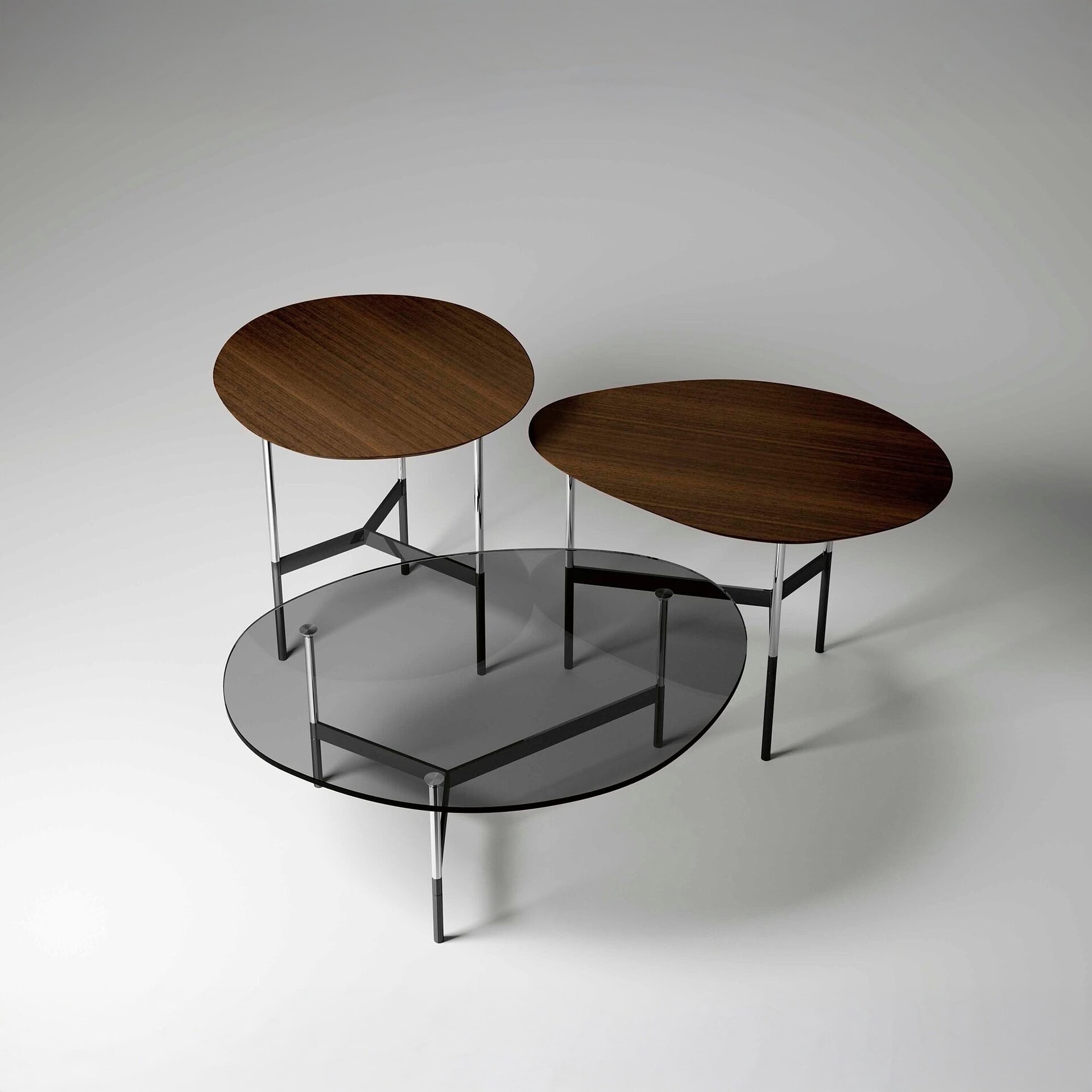Contemporary nesting coffee tables with wood and glass tops for modern living spaces.