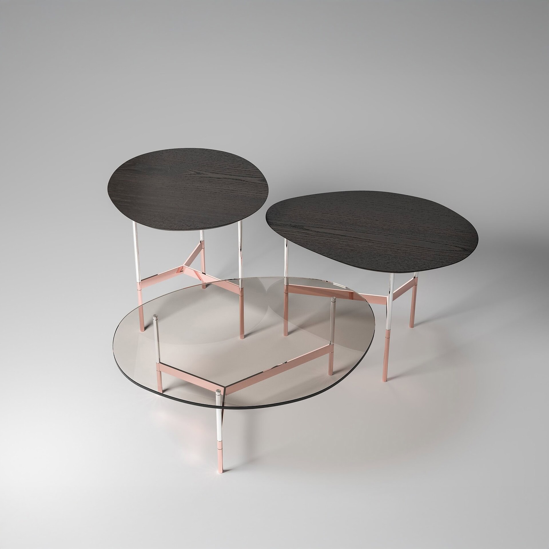 Black wooden top nesting side tables with pink metal frames and glass top coffee table.