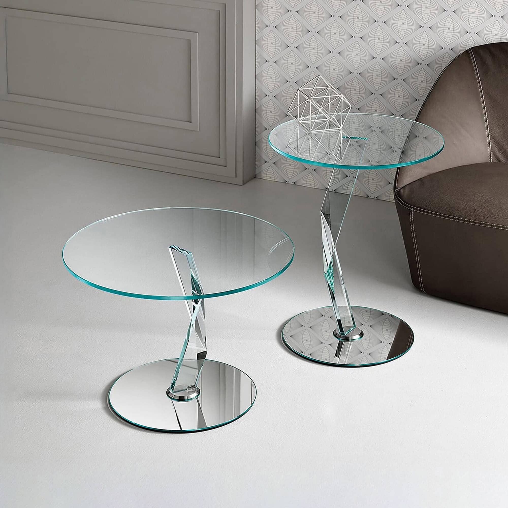 Elegant glass side tables with chrome bases for contemporary living spaces.