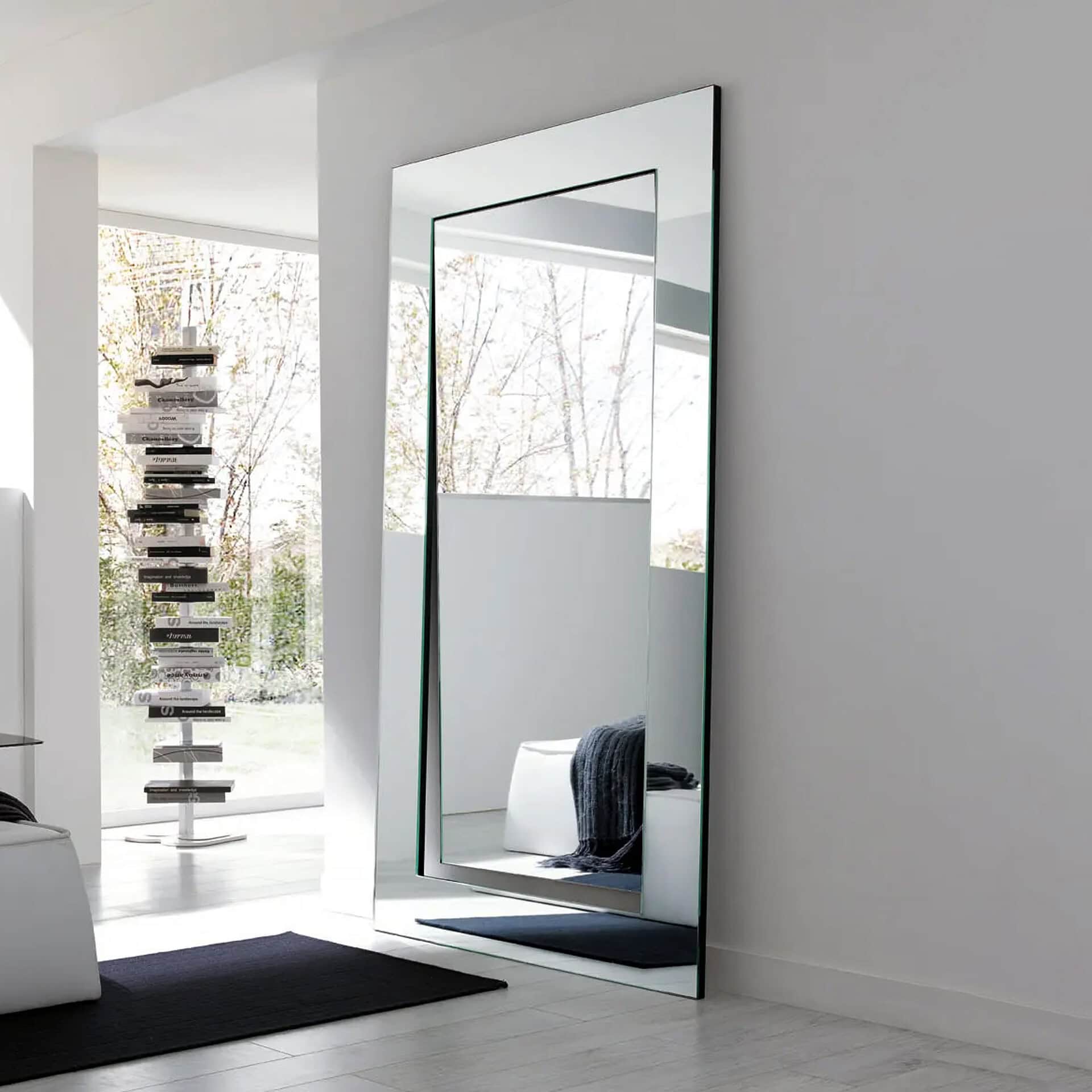 Length mirror with black frame for modern home interiors.
