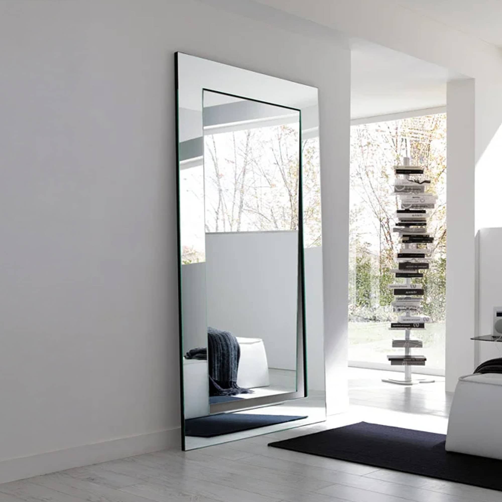 Tonelli Design Gerundio large rectangular mirror leaning against a bright modern wall.
