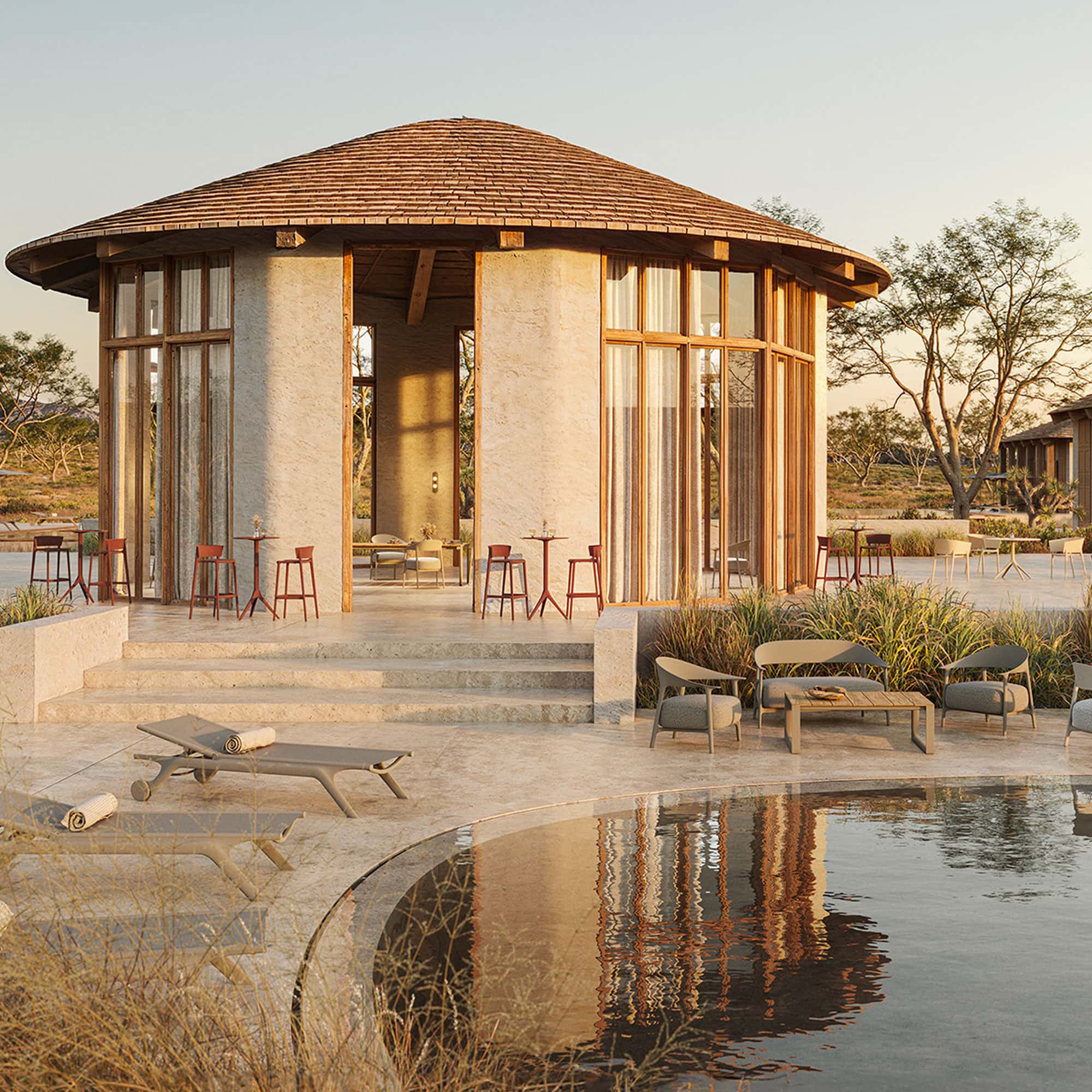 Africa Bar Stools arranged outdoors on a patio near water, blending with a warm natural setting.