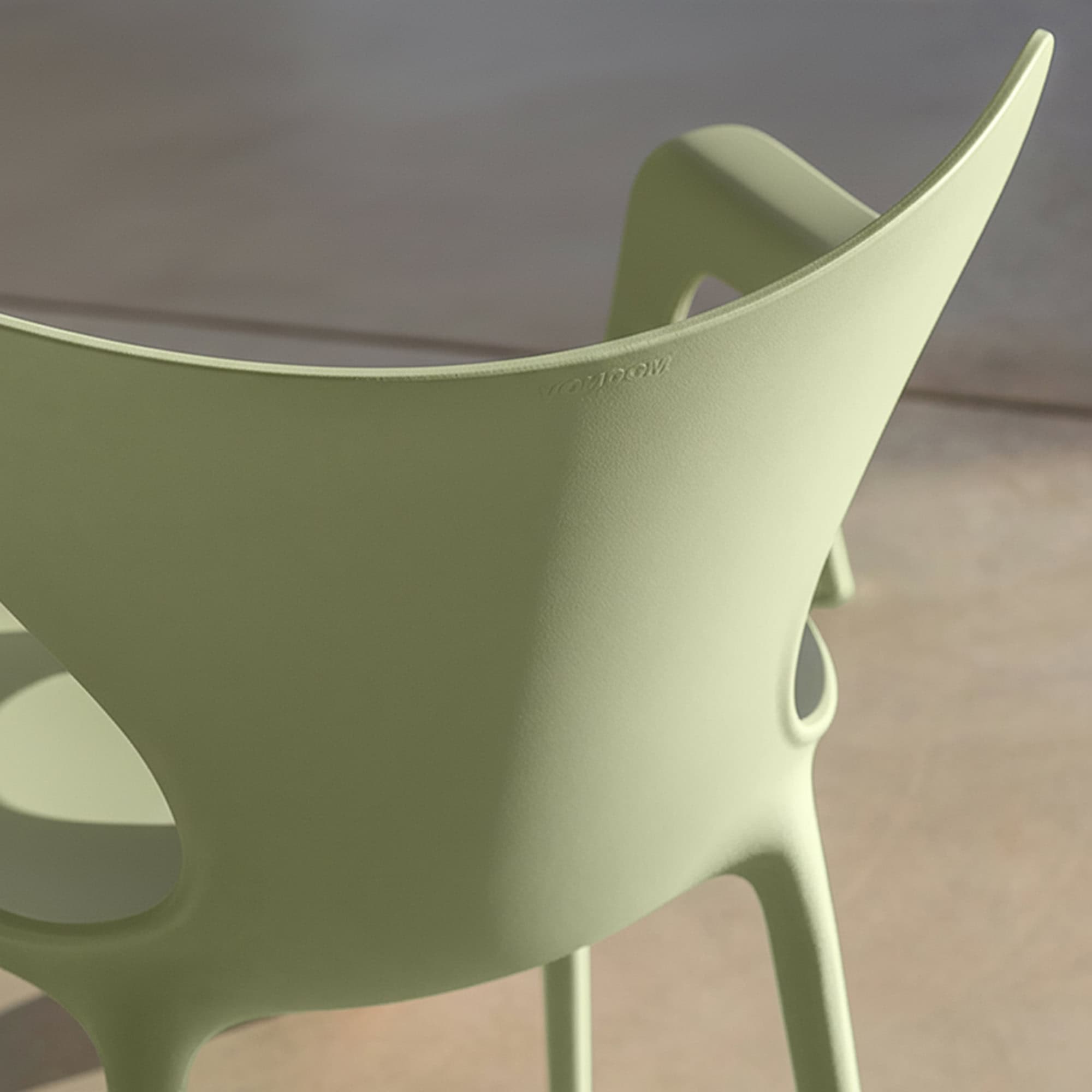 Modern lime green plastic chair for contemporary dining and outdoor seating.