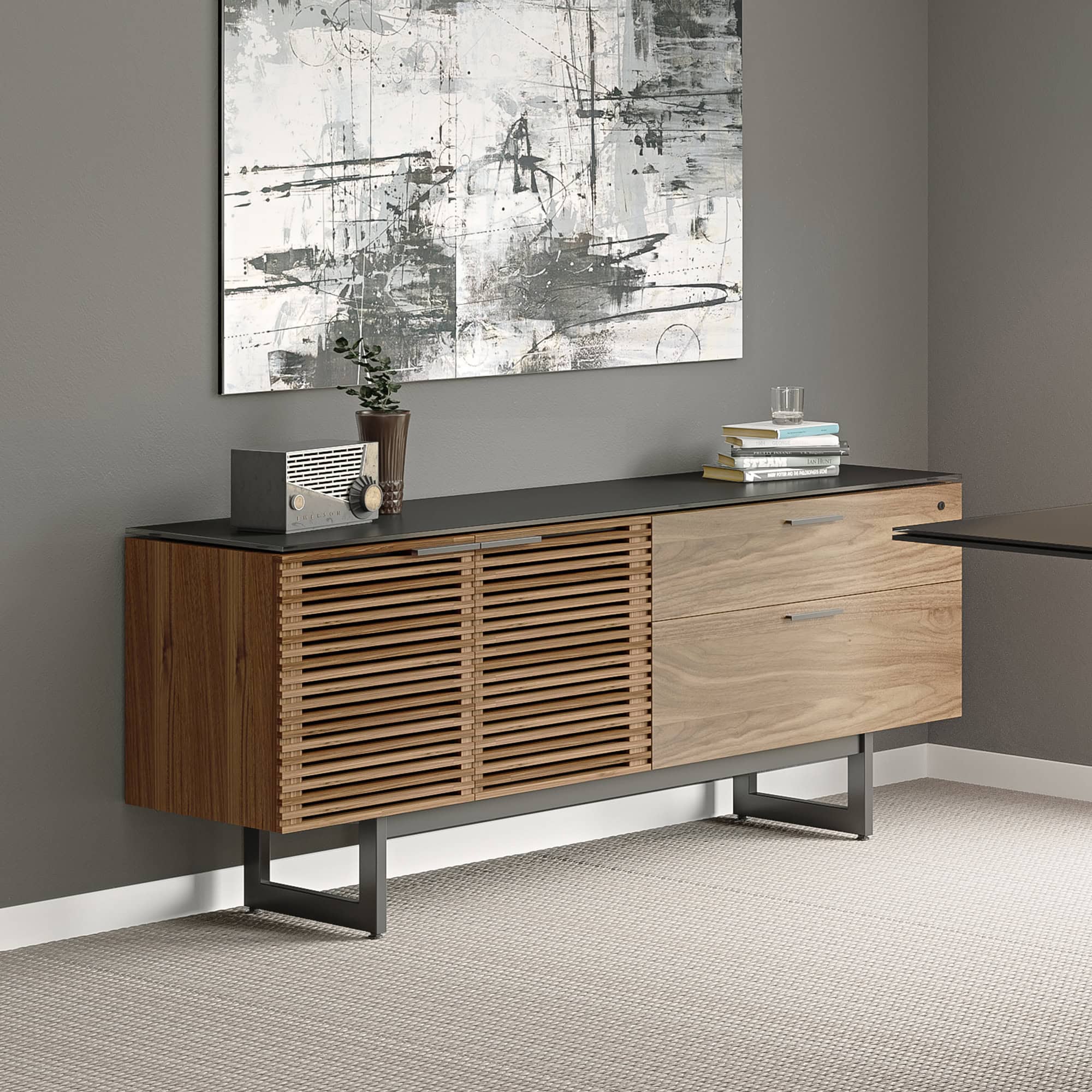 Modern wooden sideboard with slatted doors and black top decor, ideal for contemporary living spaces.