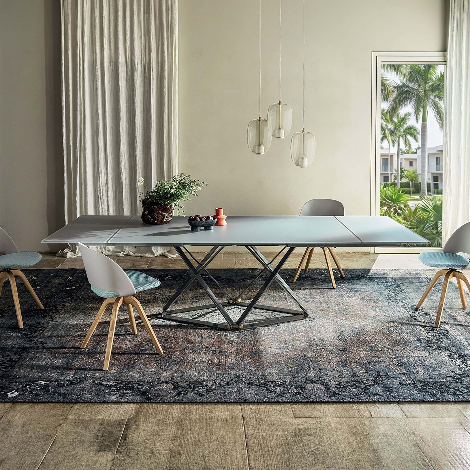 Extendable dining table with sleek design, perfect for modern dining rooms and gatherings.