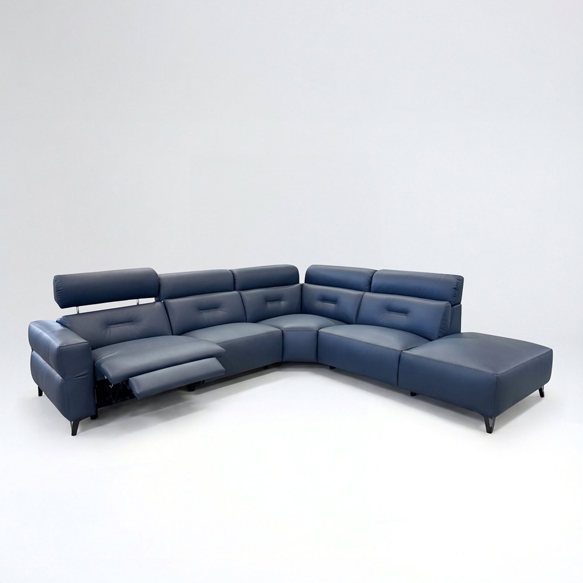 Luxurious navy blue leather sectional sofa with adjustable headrests and chaise lounge. Perfect for modern living rooms.