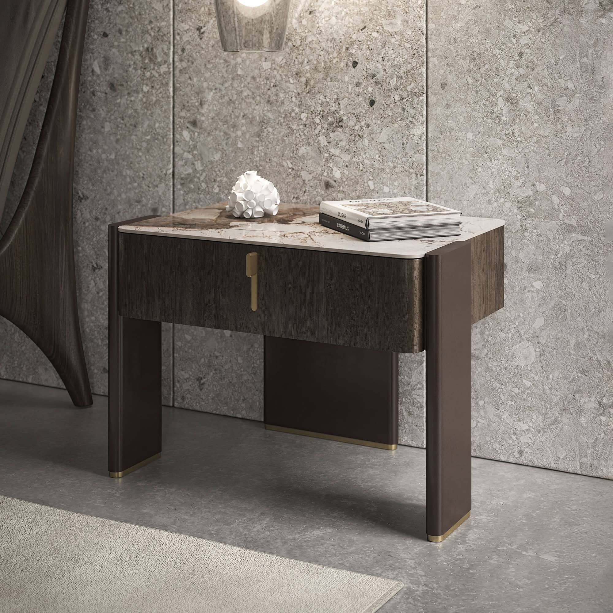 Angled view of Julian 1-Drawer Nightstand with walnut drawer and ceramic top, styled in a modern bedroom with concrete walls and pendant lights.