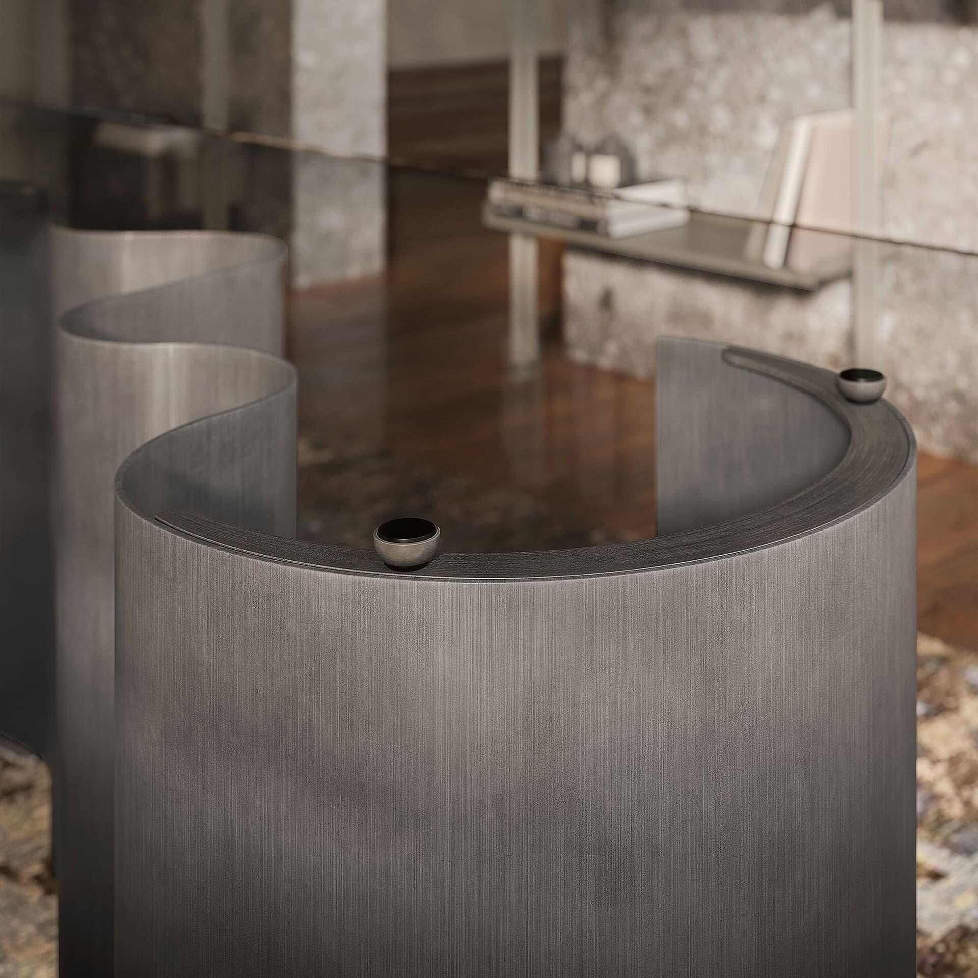 Elegant curved reception desk with sleek gray finish for contemporary office spaces.