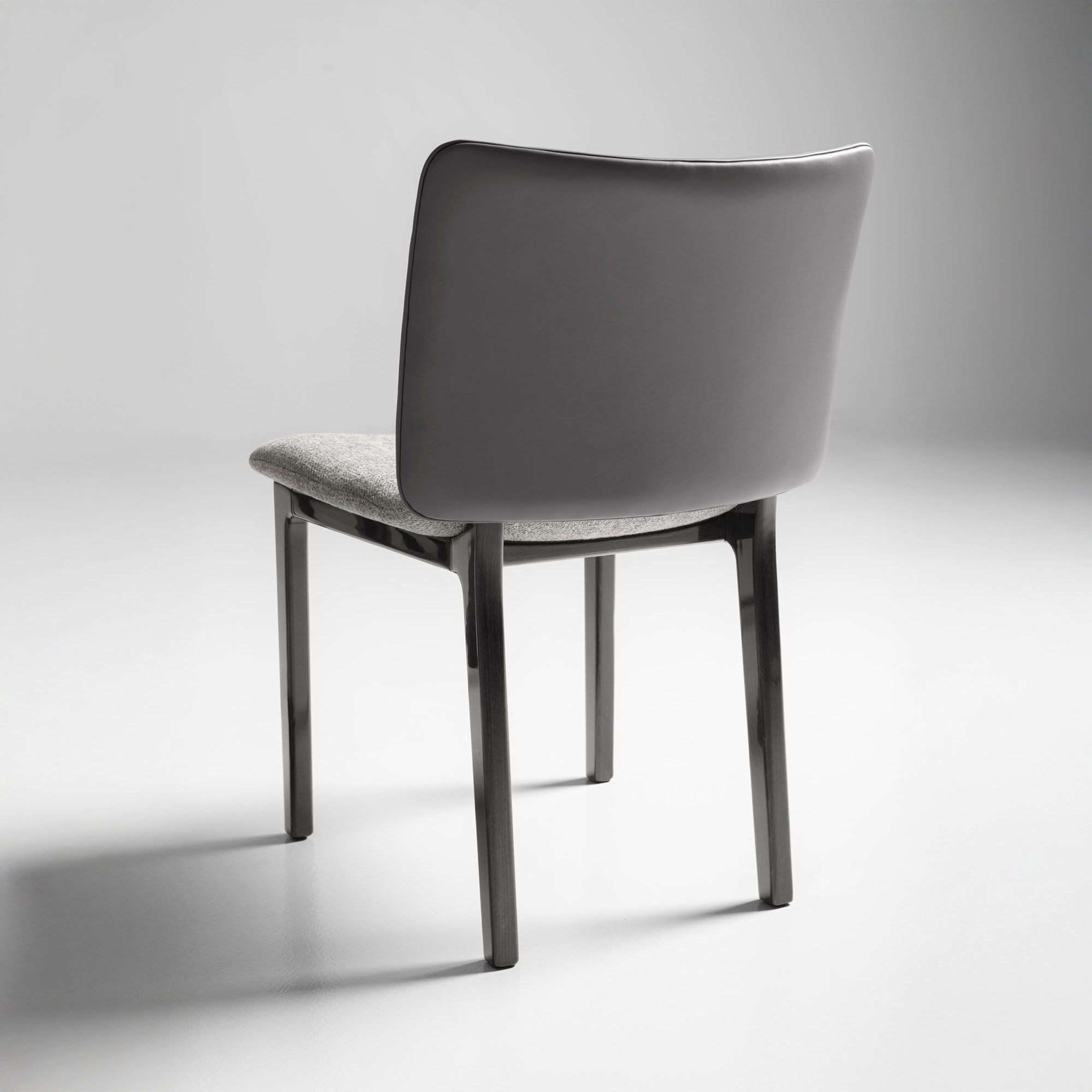 Angled back view of the Nora Dining Chair highlighting its clean silhouette.