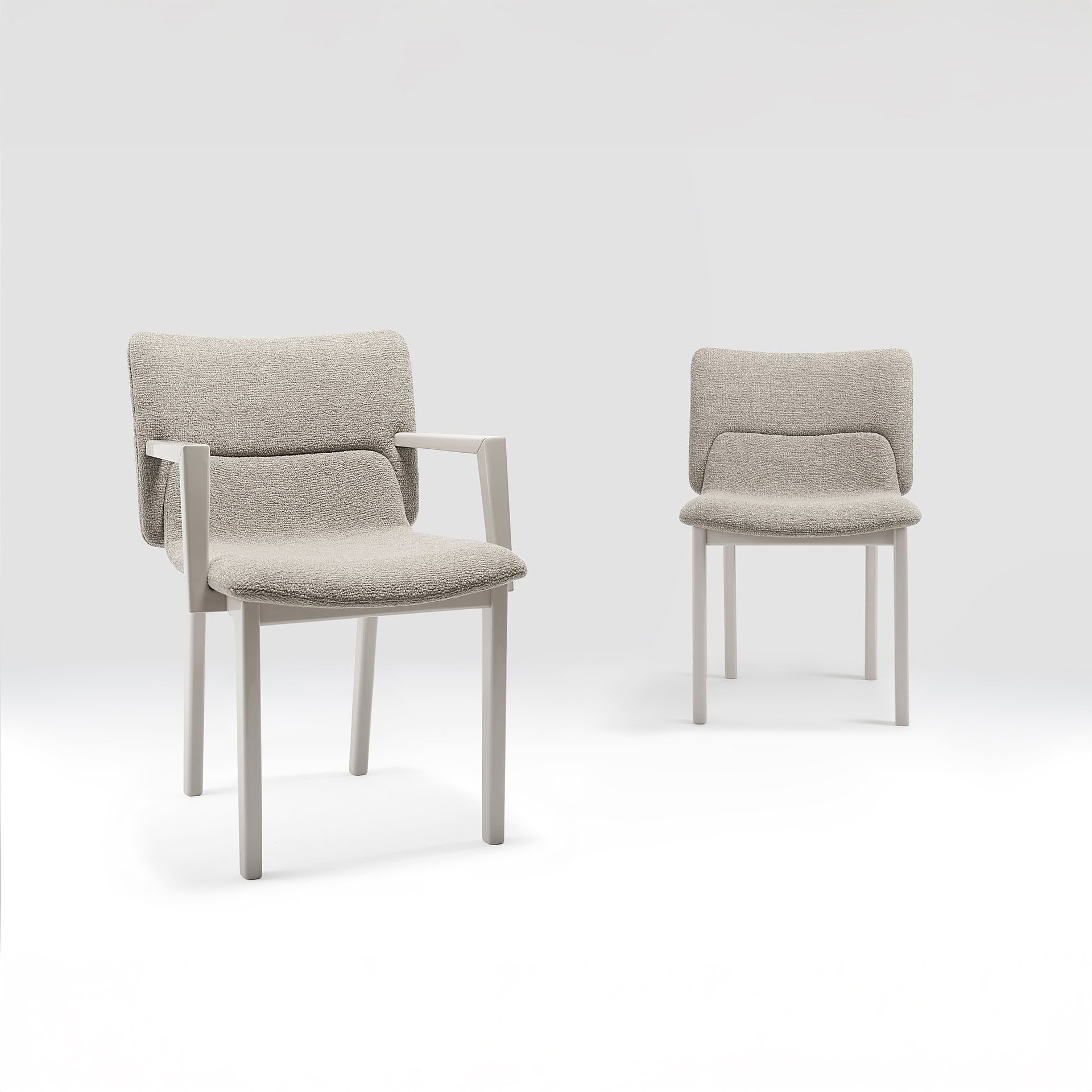 Pair of Nora Dining Chairs shown in a neutral upholstered finish.