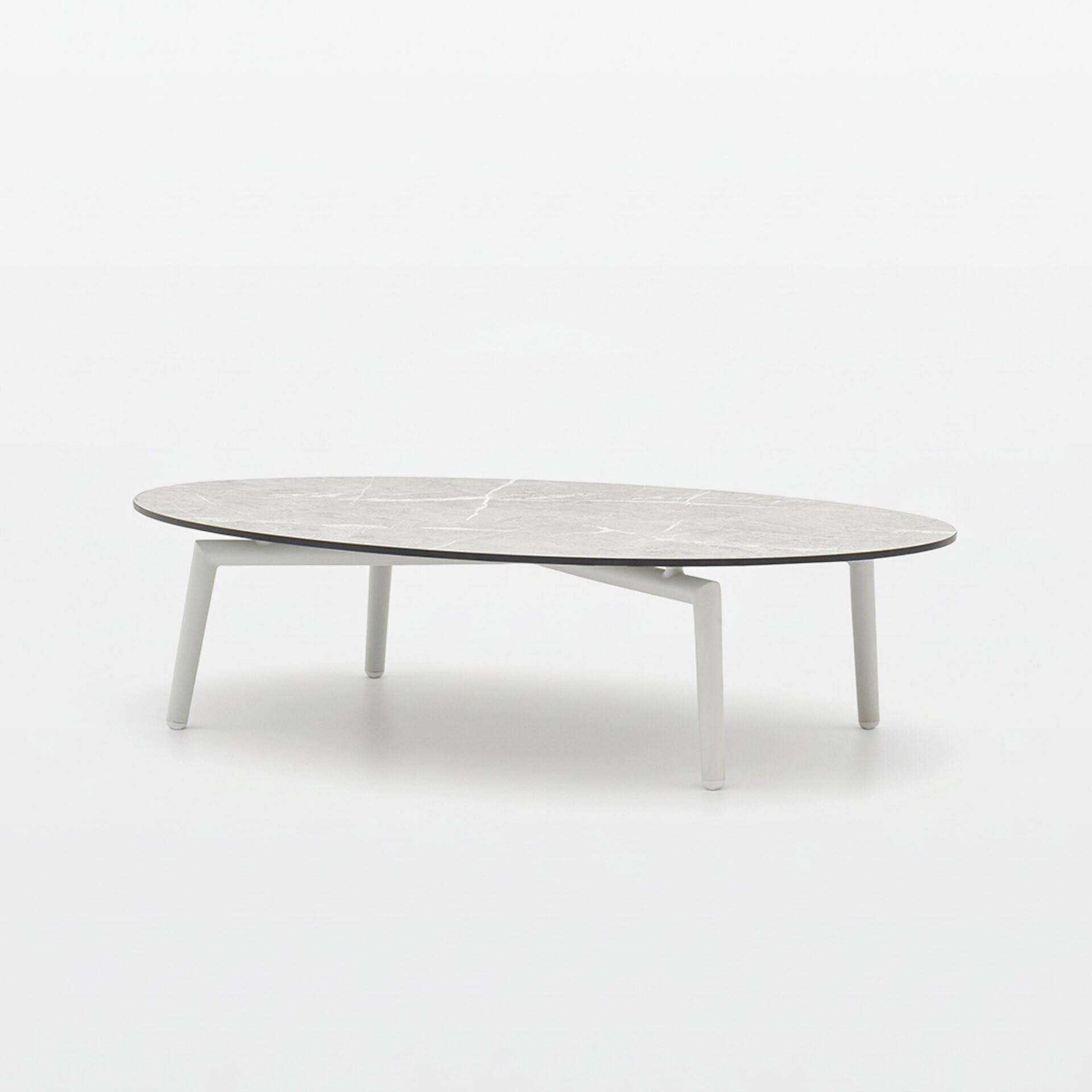 Modern oval coffee table with a light grey marble-patterned top and white, slender legs on a white background.