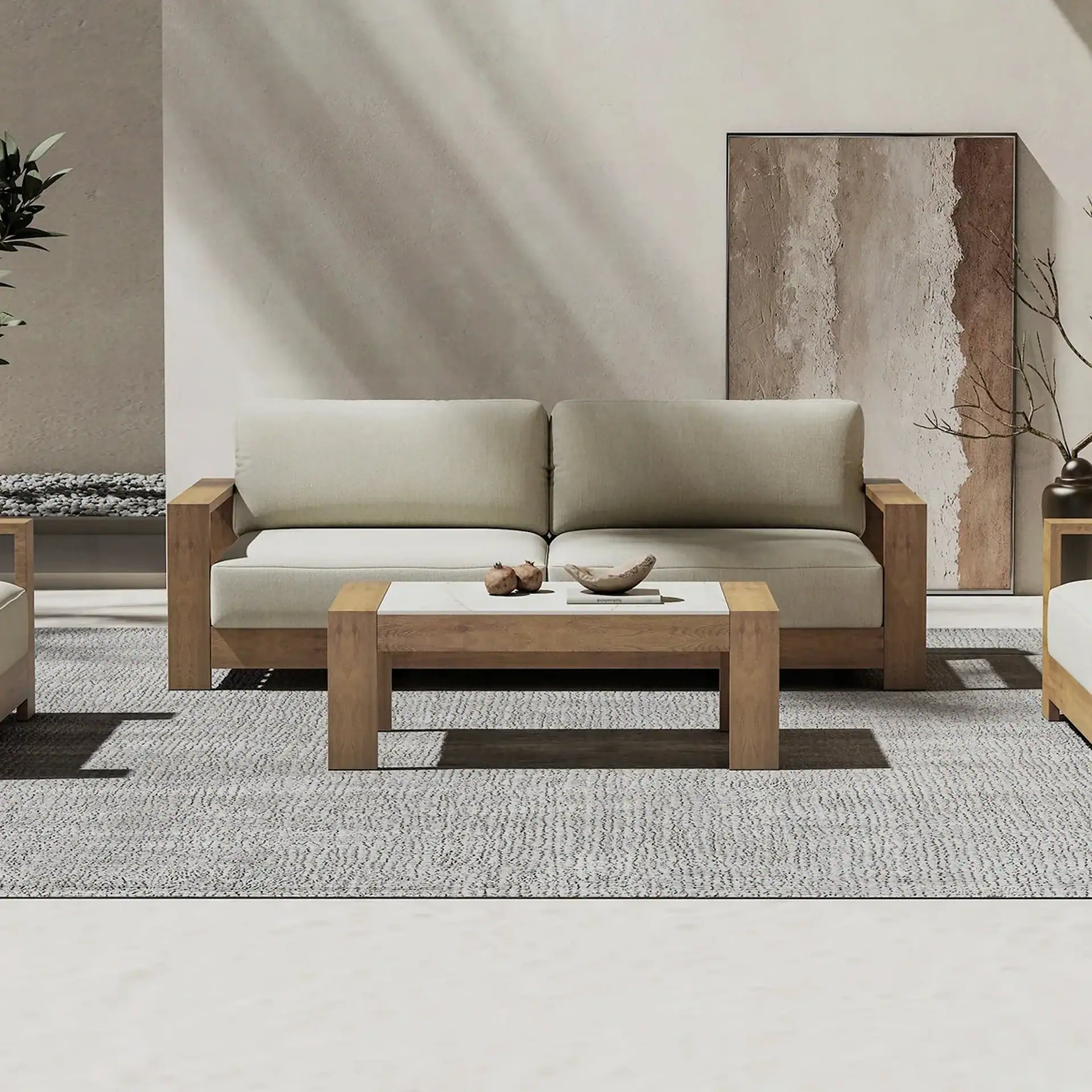 A modern living room featuring a light beige sofa with a wooden frame, a wooden coffee table with a white marble top, and abstract art on a light wall, all on a grey textured rug.