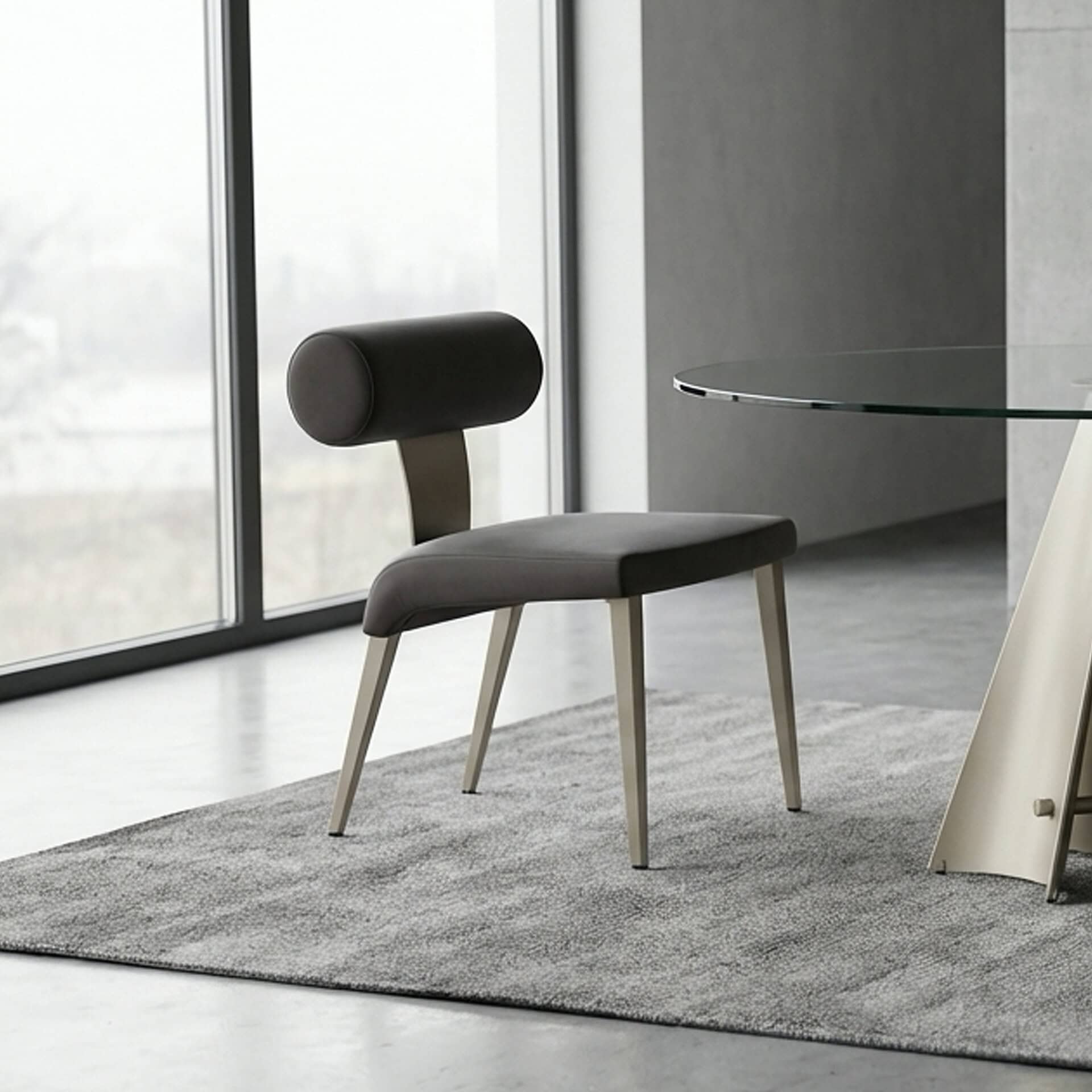 Upholstered Bolo dining chair with modern design and comfortable cushioning. Perfect for contemporar.