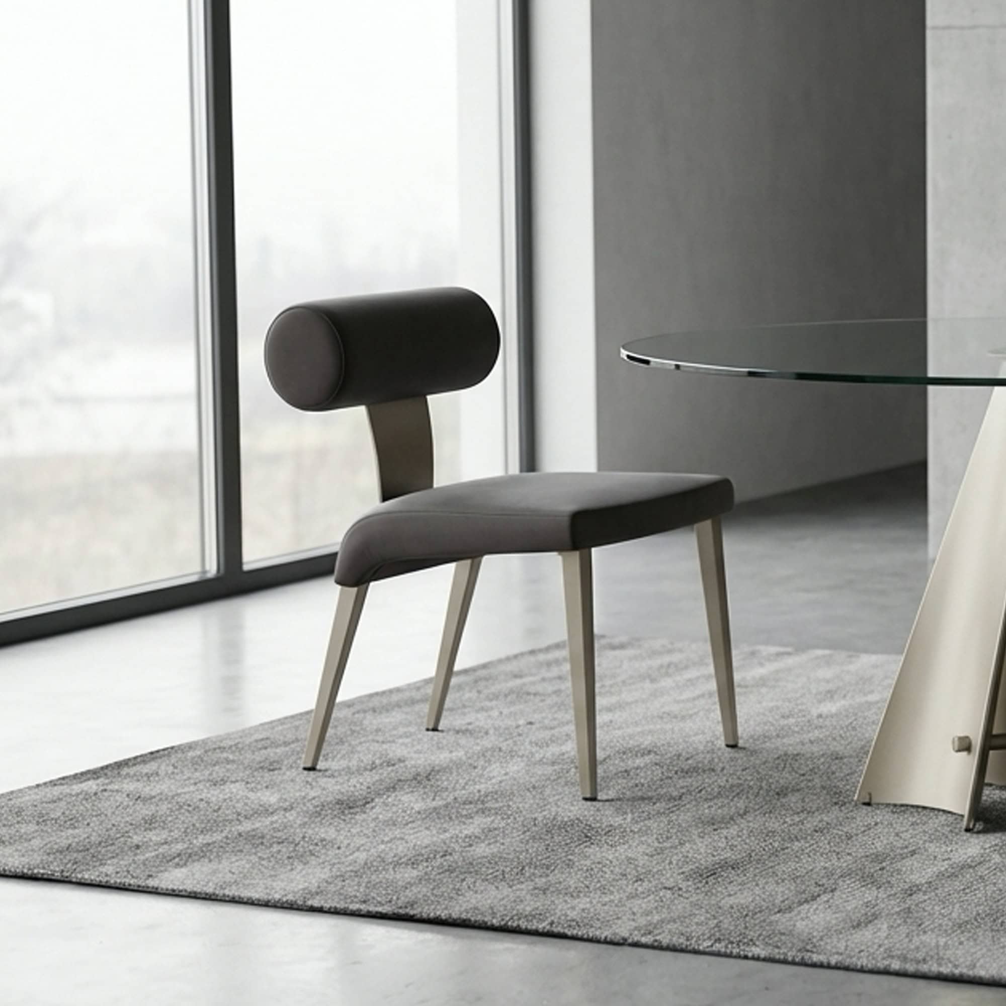 Upholstered Bolo dining chair with modern design and comfortable cushioning. Perfect for contemporar.