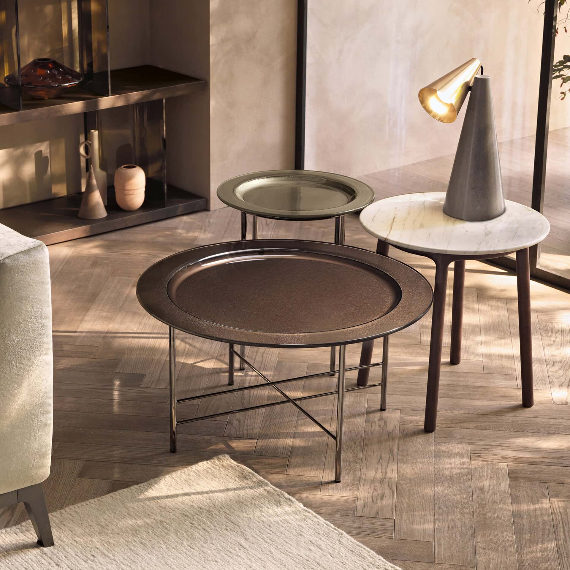 Elegant glass coffee table with sleek metal frame in contemporary living room setting.