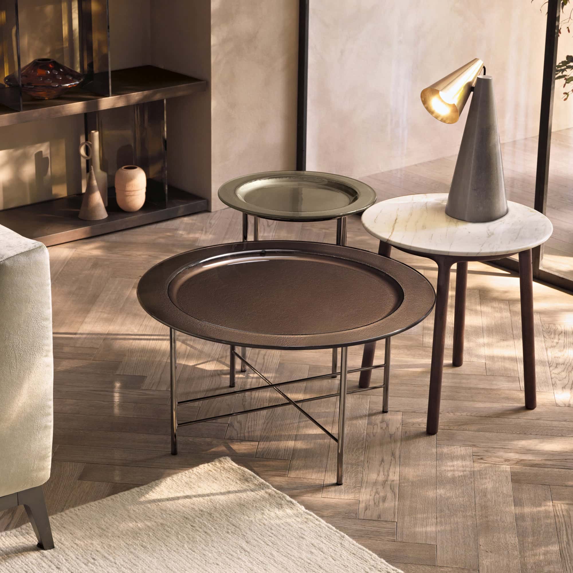 Elegant glass coffee table with sleek metal frame in contemporary living room setting.