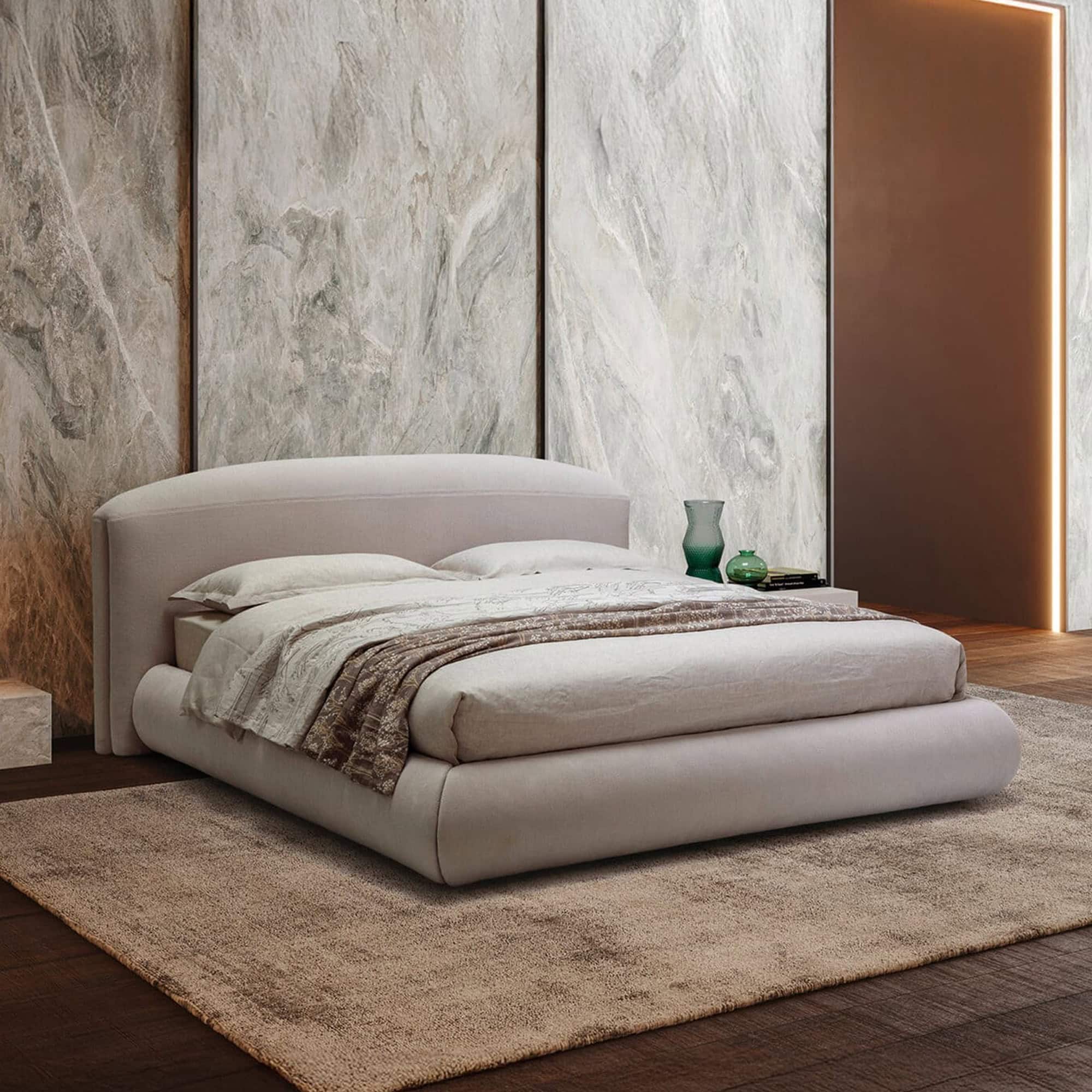 Modern Quentin upholstered platform bed with sleek design and plush fabric.