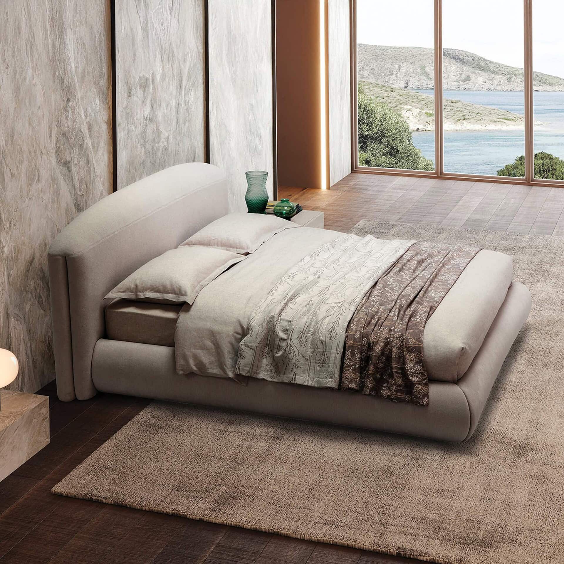 Quentin Upholstered Platform Bed positioned by large windows with natural light and a scenic view.