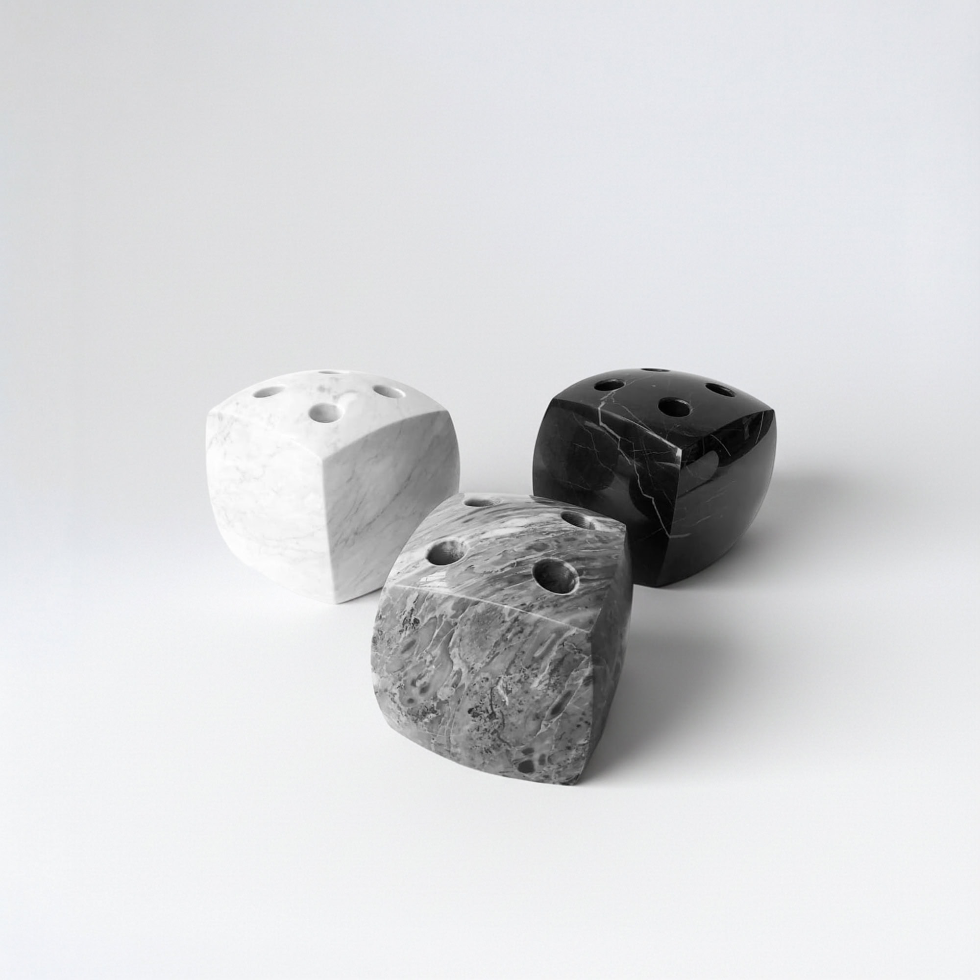 Sleek marble dice set with black, white, and gray designs for modern tabletop gaming.
