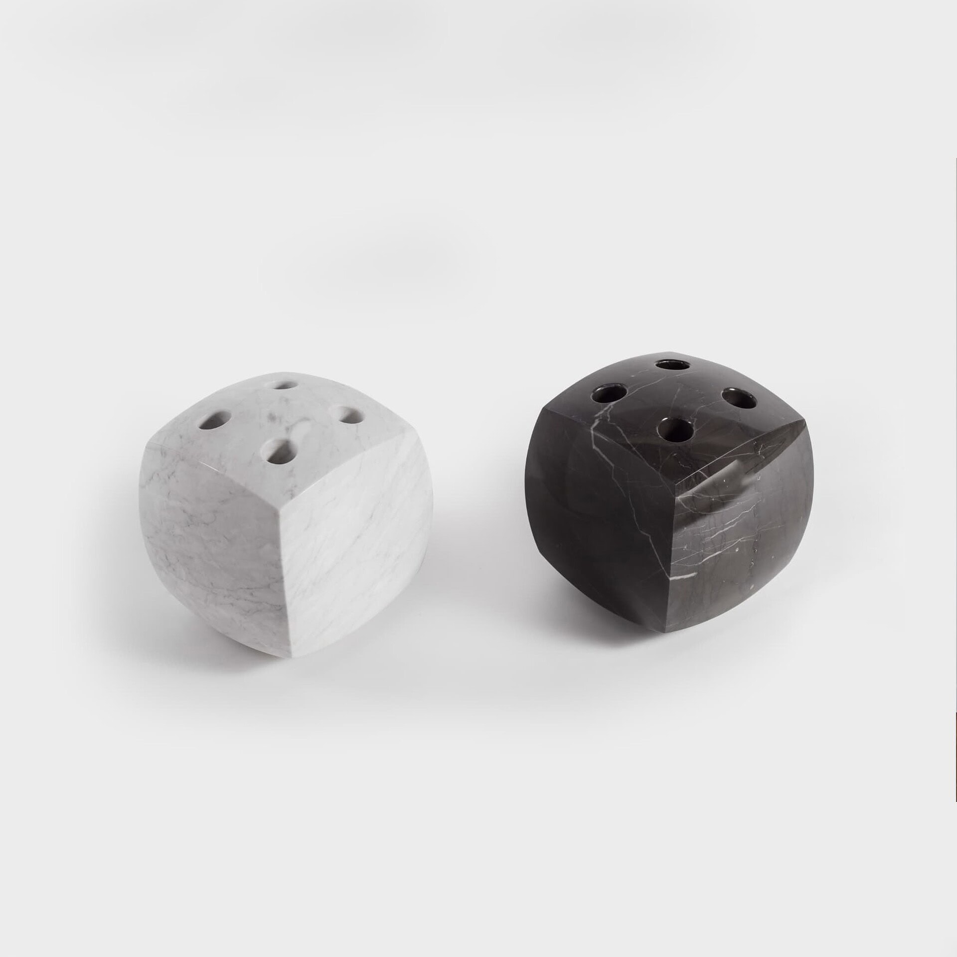 Marble dice set for modern games, black and white marble, luxury home decor accessories.