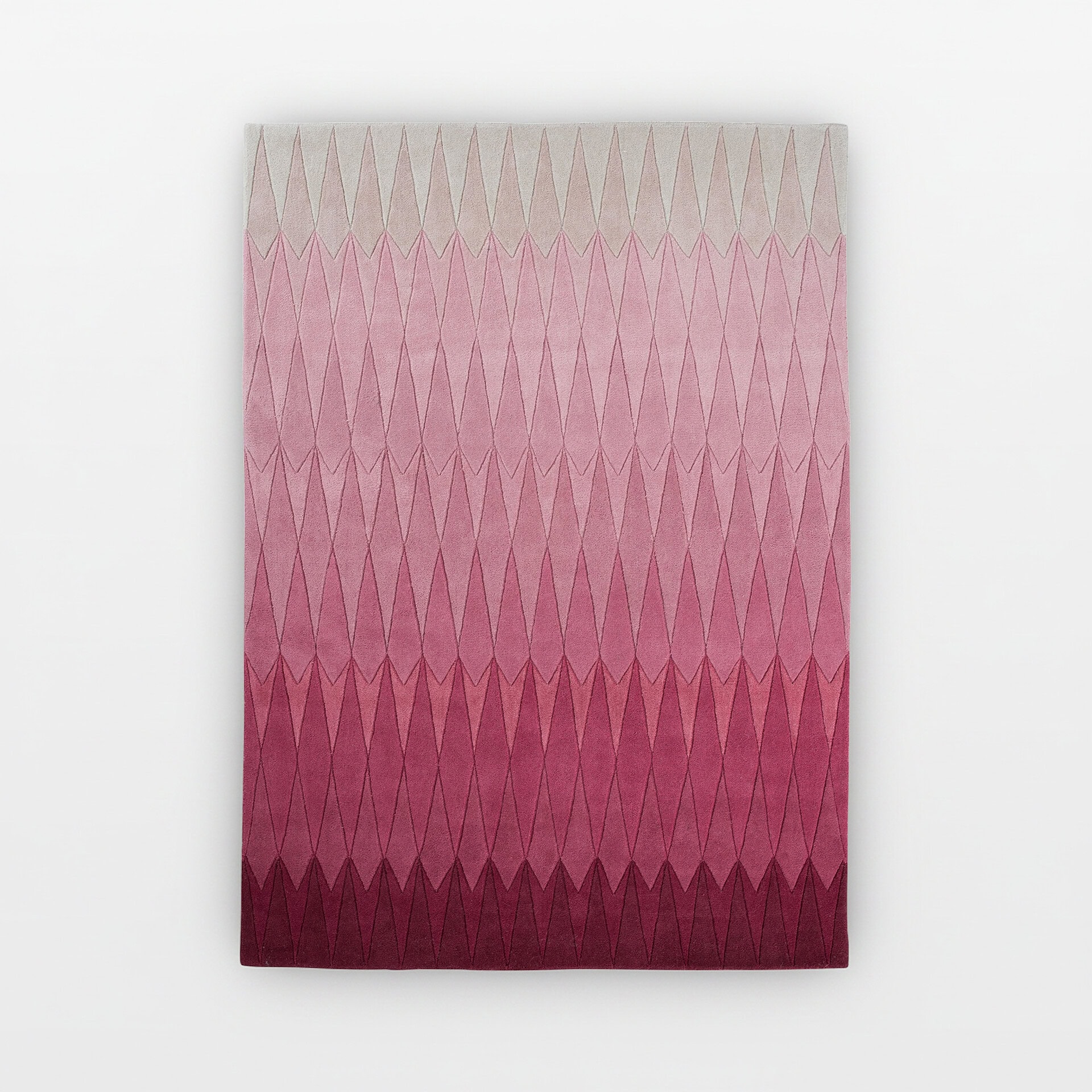 Hand-tufted wool rug with a pink to burgundy gradient diamond pattern. Perfect for adding warmth and.