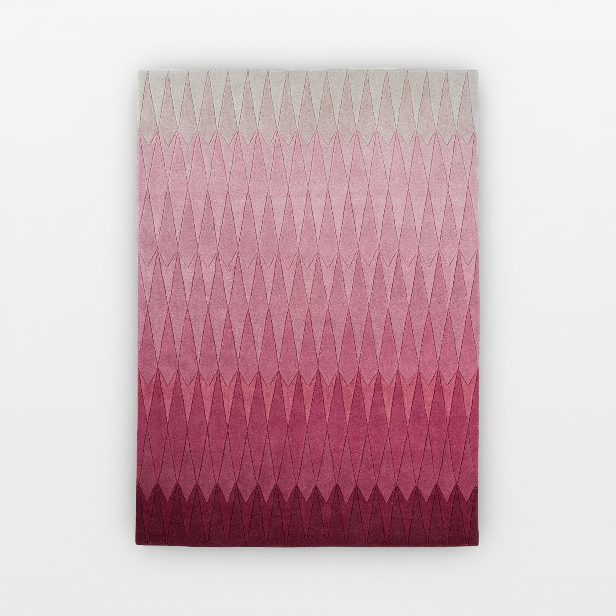 Hand-tufted wool rug with a pink to burgundy gradient diamond pattern. Perfect for adding warmth and.