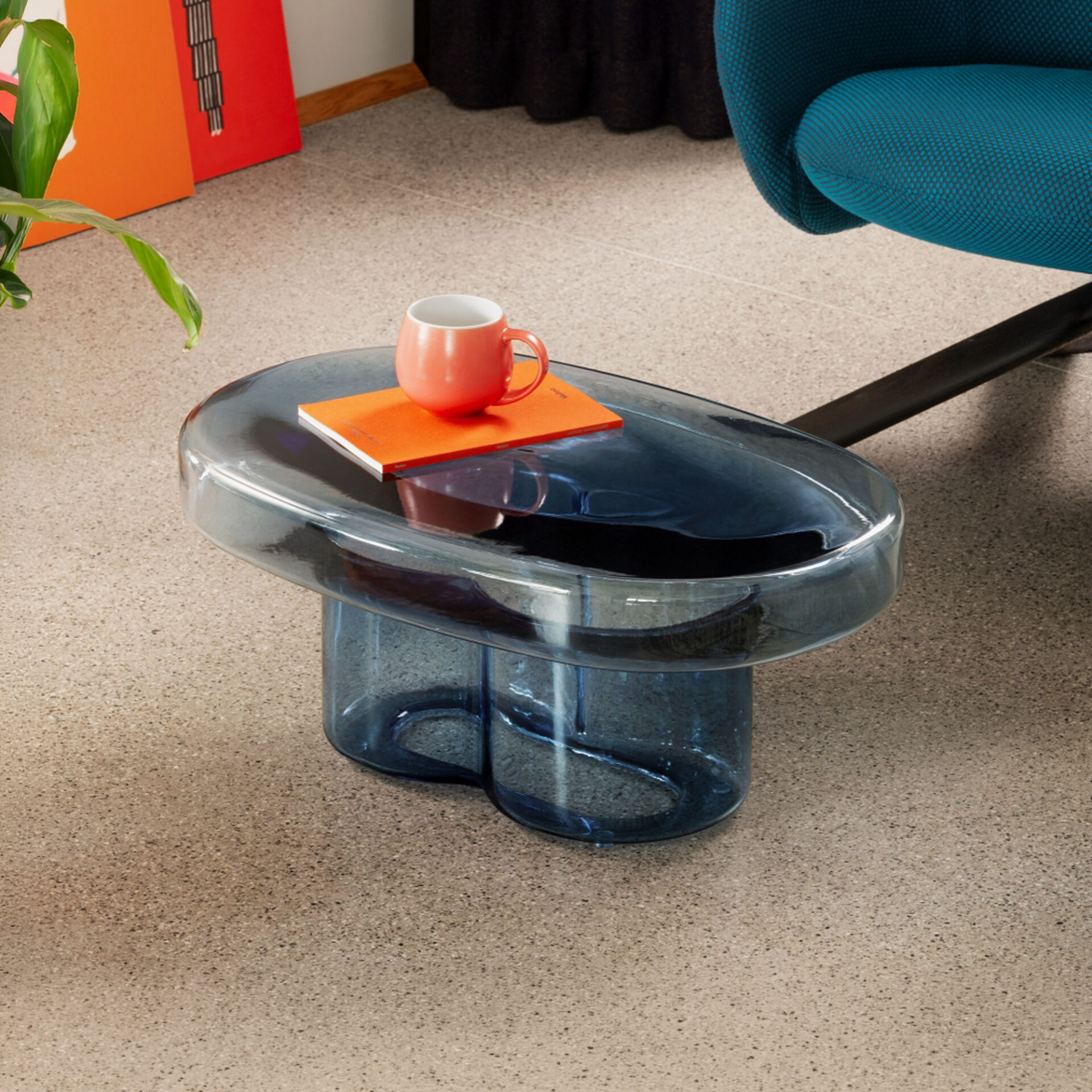 Blue Soda Oval Coffee Table styled in a modern room with colorful accents and decor.
