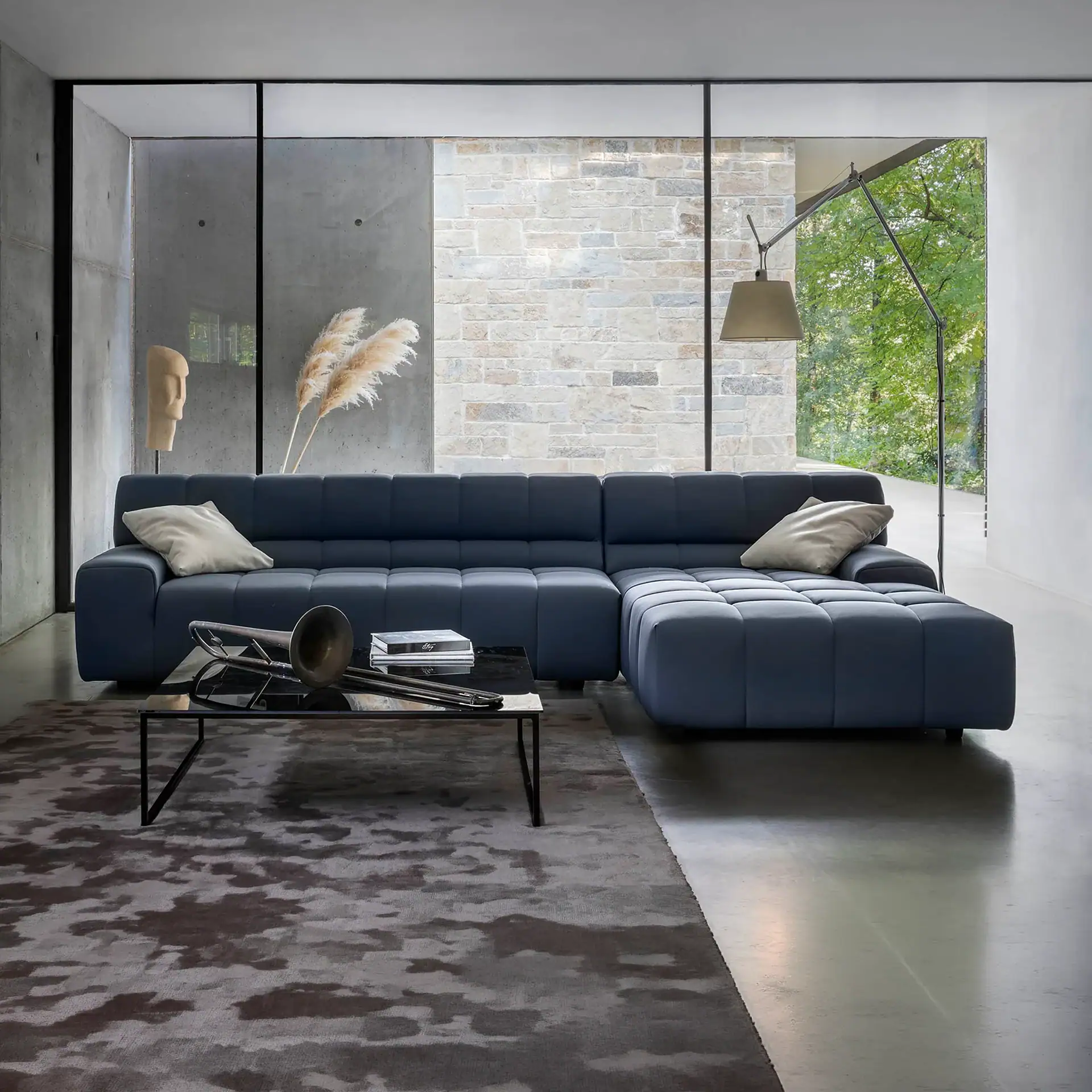 Navy blue sectional sofa for modern living room, featuring sleek design and comfortable seating.