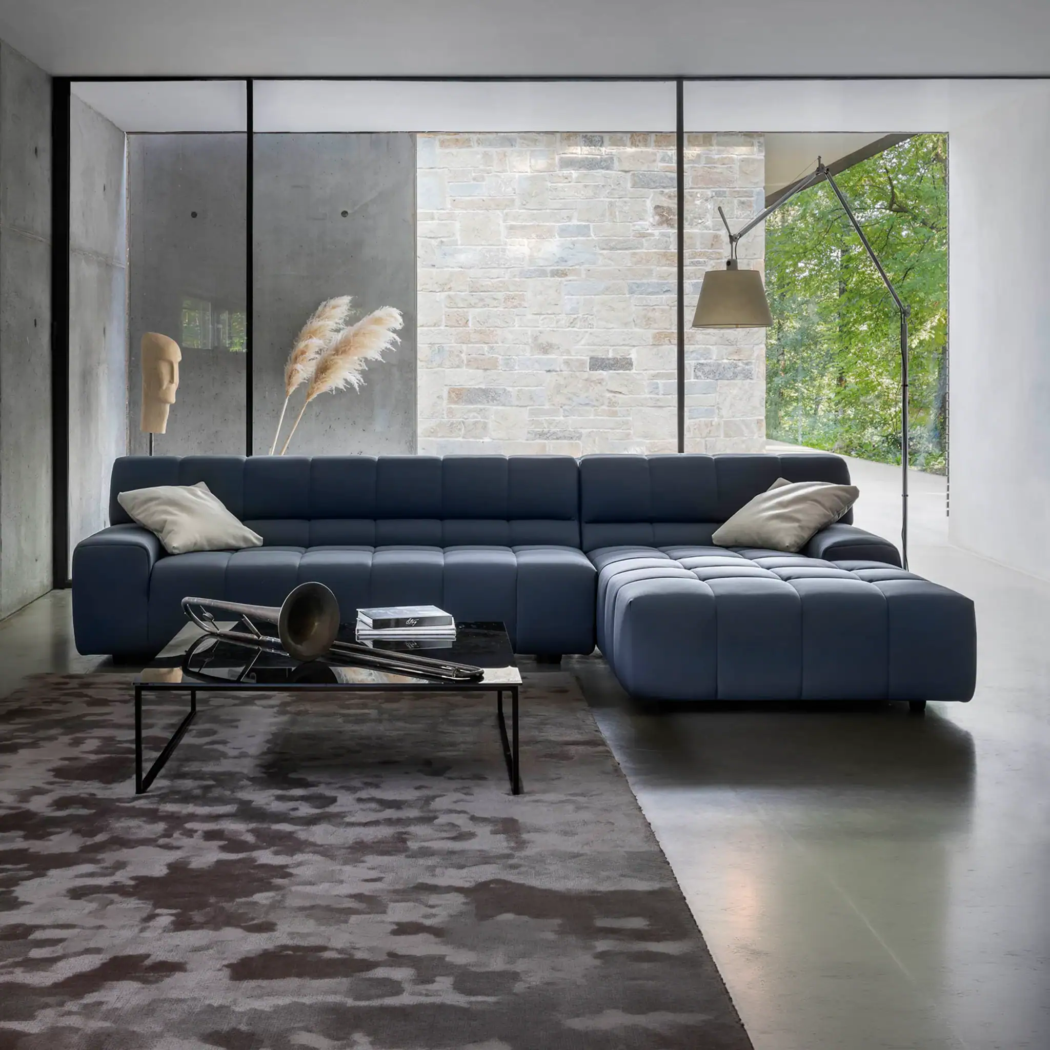 Navy blue sectional sofa for modern living room, featuring sleek design and comfortable seating.
