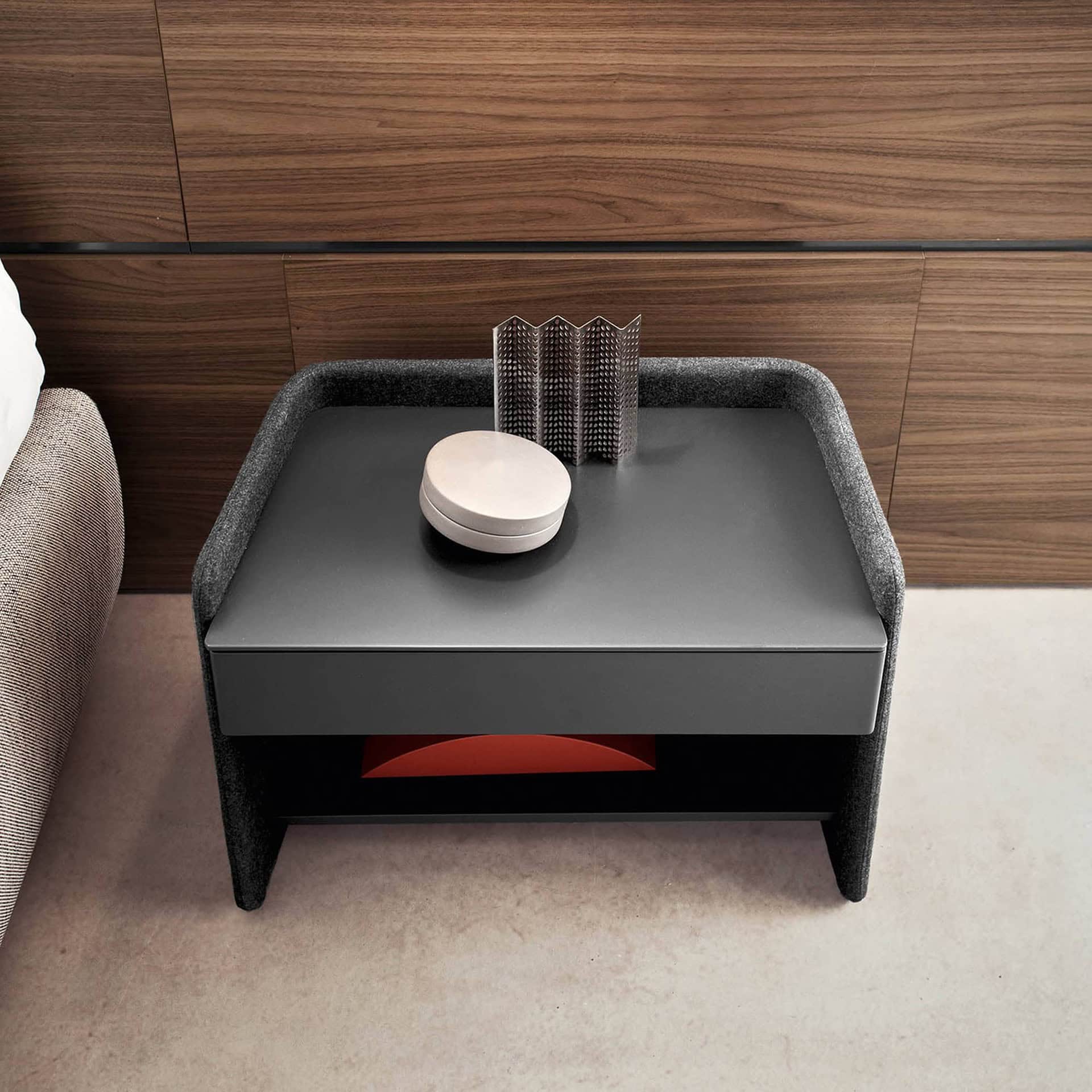 Overhead view of the Chloé Upholstered Nightstand highlighting its C-shaped frame and minimalist drawer design.