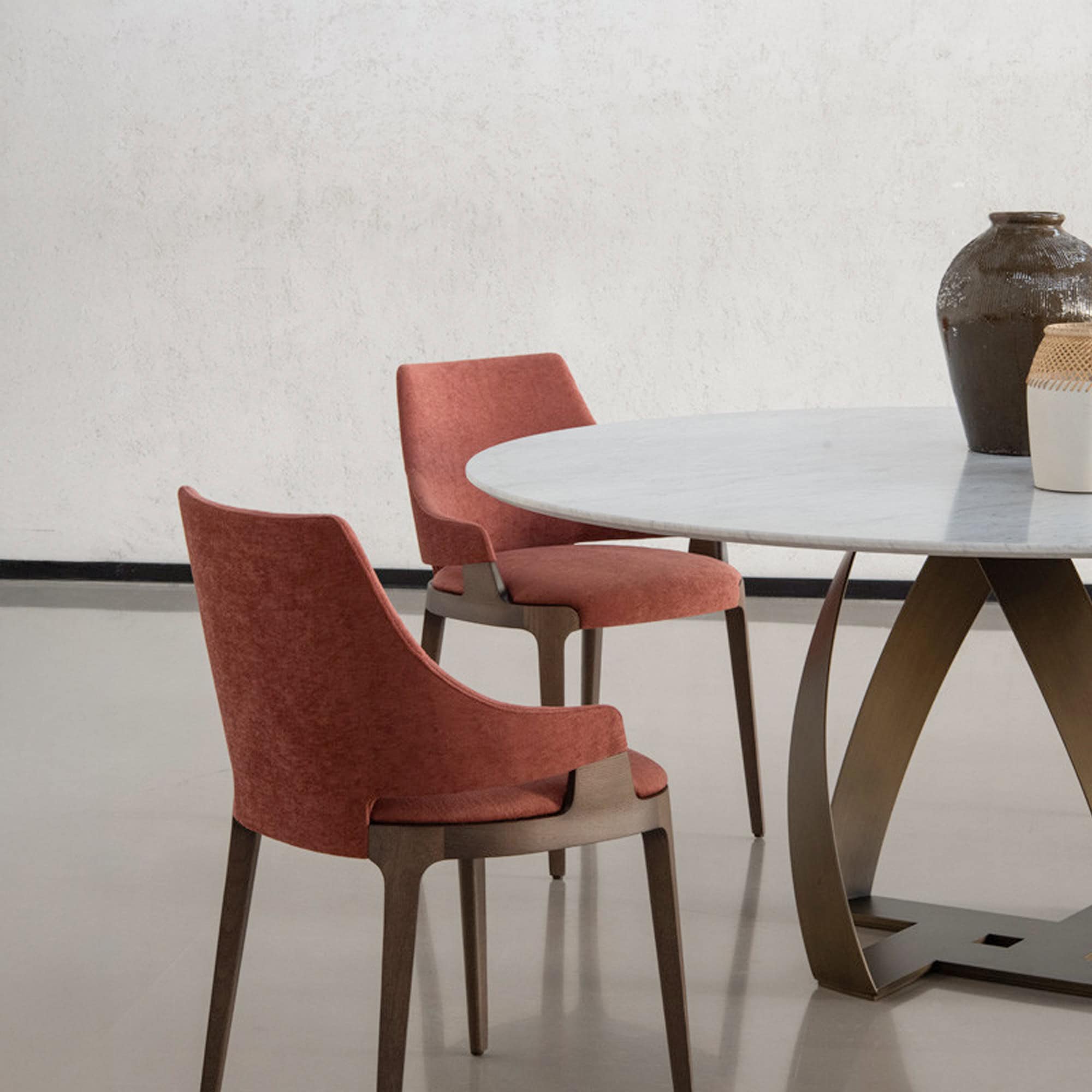 Elegant Potocco dining chairs paired with a contemporary table for stylish interiors.