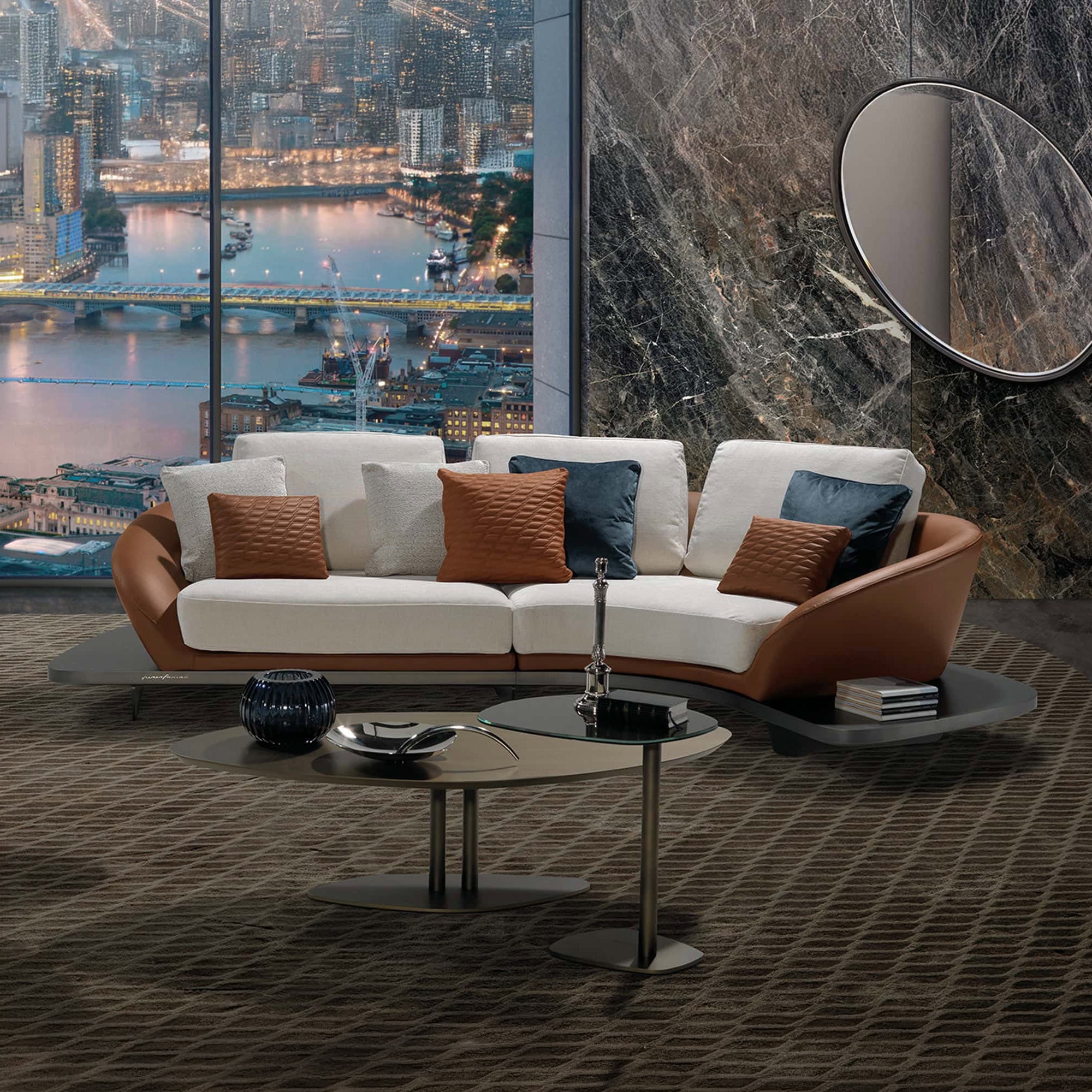 Elegant Segno modular sectional sofa with neutral tones and colorful accent pillows in a contemporar.