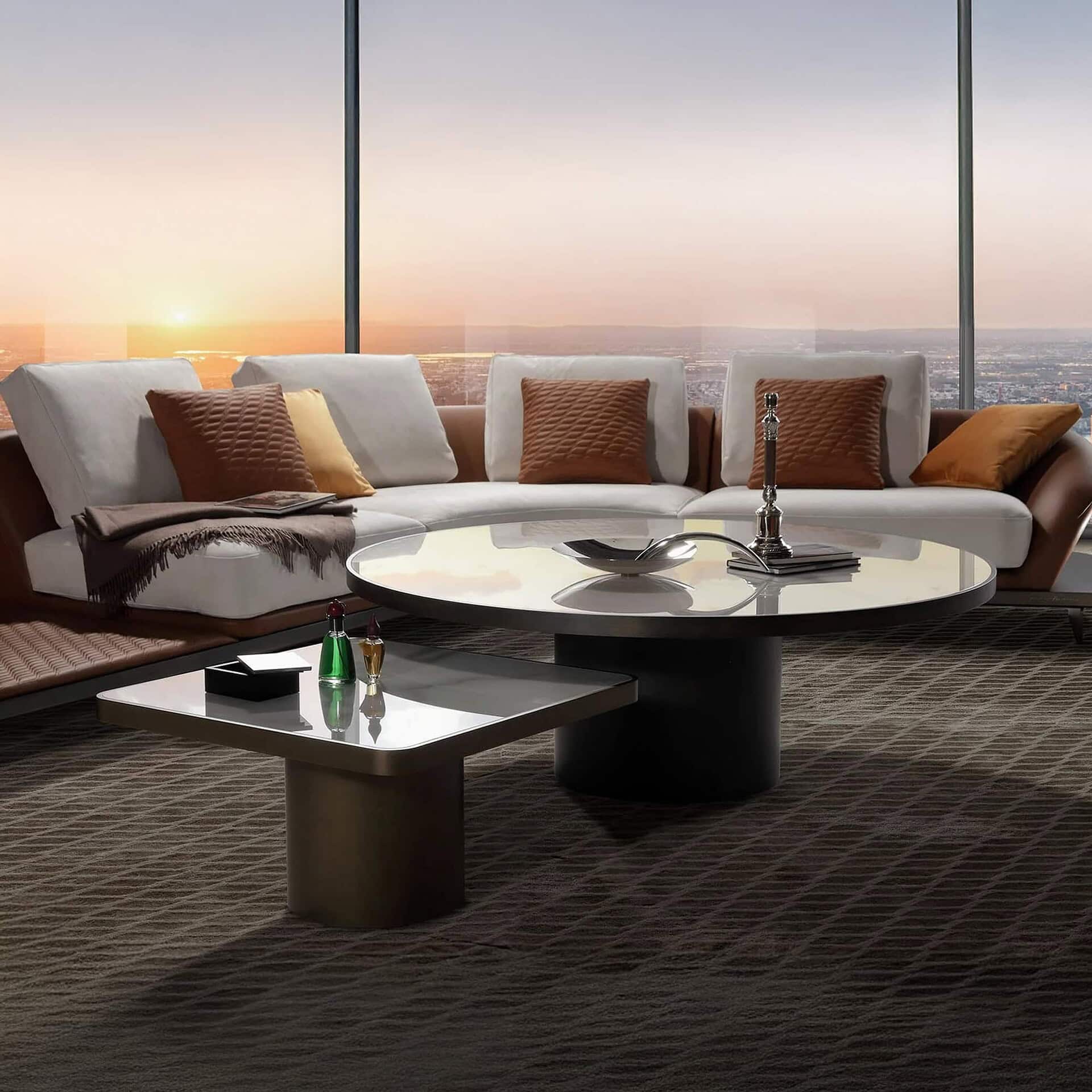 au 40 Steel Coffee Table in a large round format with marble top, paired with sectional sofa in a contemporary interior.