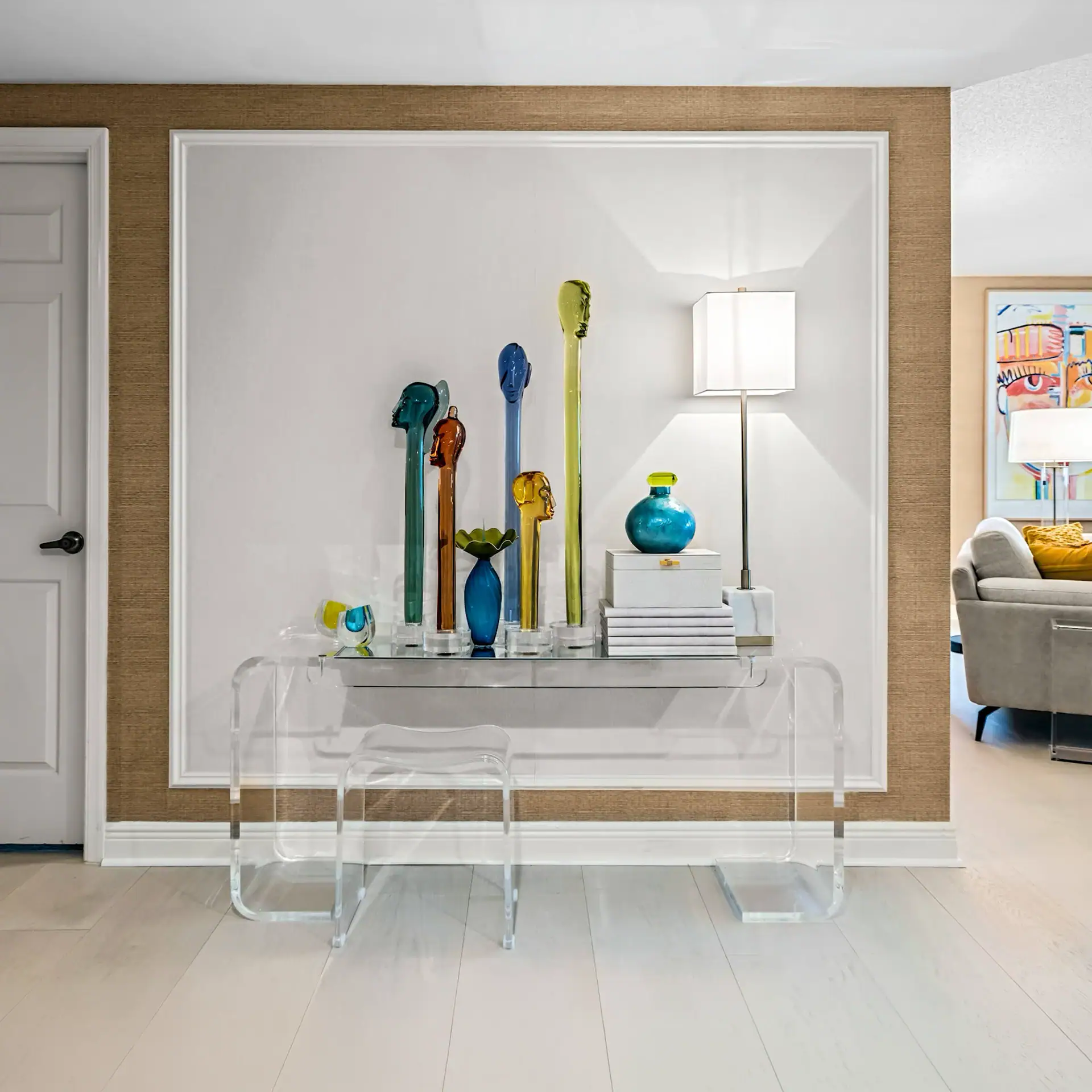 Sklar Furnishings Modern Decor Modern decorative vases and lamp on a white console table.