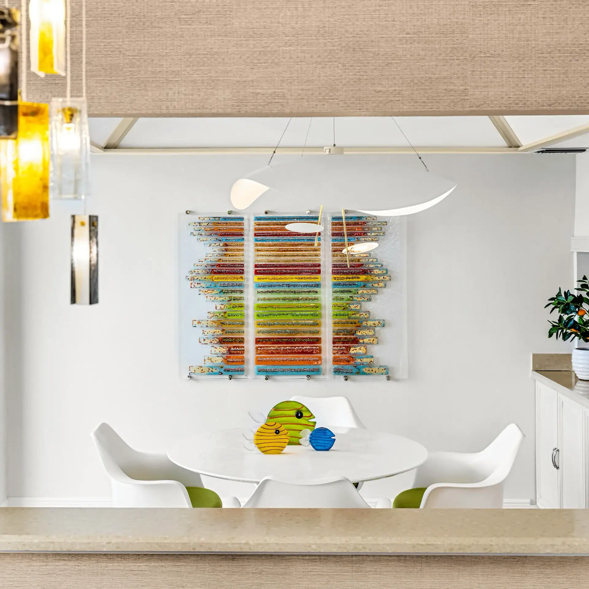 Modern colorful wall art in dining room Colorful abstract wall art with vibrant hues in a contemporary dining space.