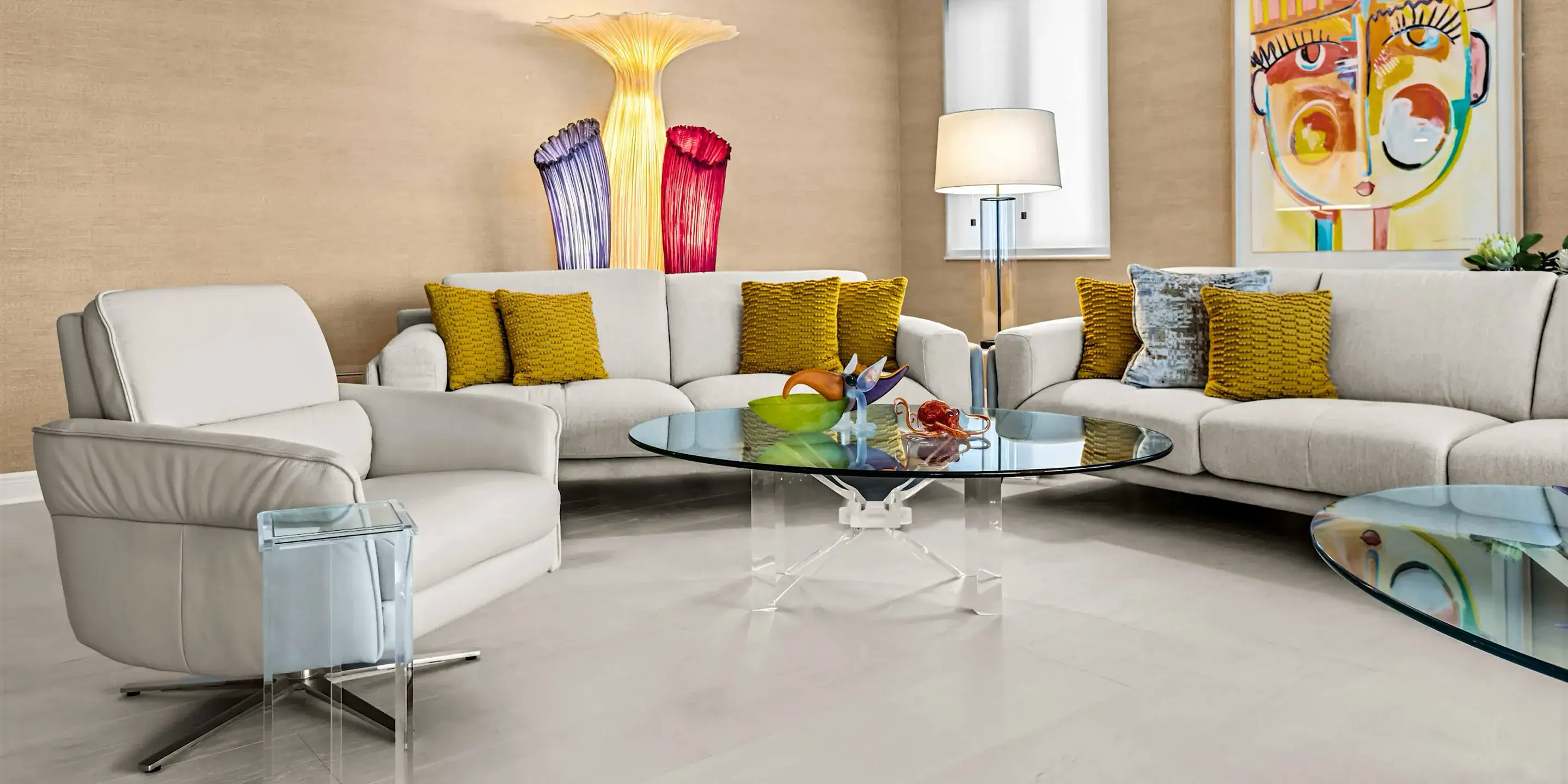 Modern Living Room with Stylish Sofas and Art Decor Contemporary living room featuring white sofas, colorful cushions, and vibrant wall art, showcasing.