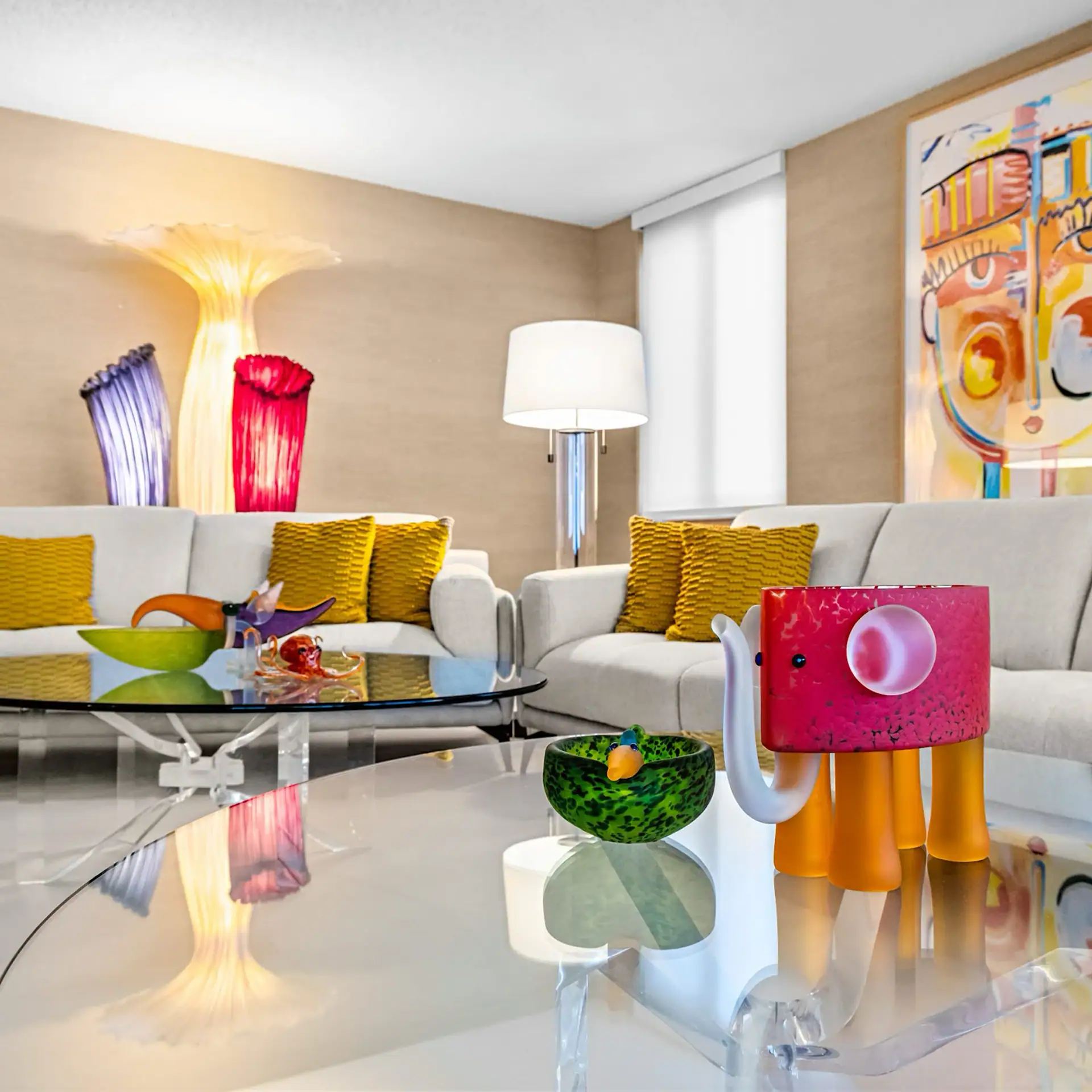Modern Living Room with Colorful Decor and Unique Art Pieces Contemporary living room featuring vibrant art, colorful vases, and stylish furniture.