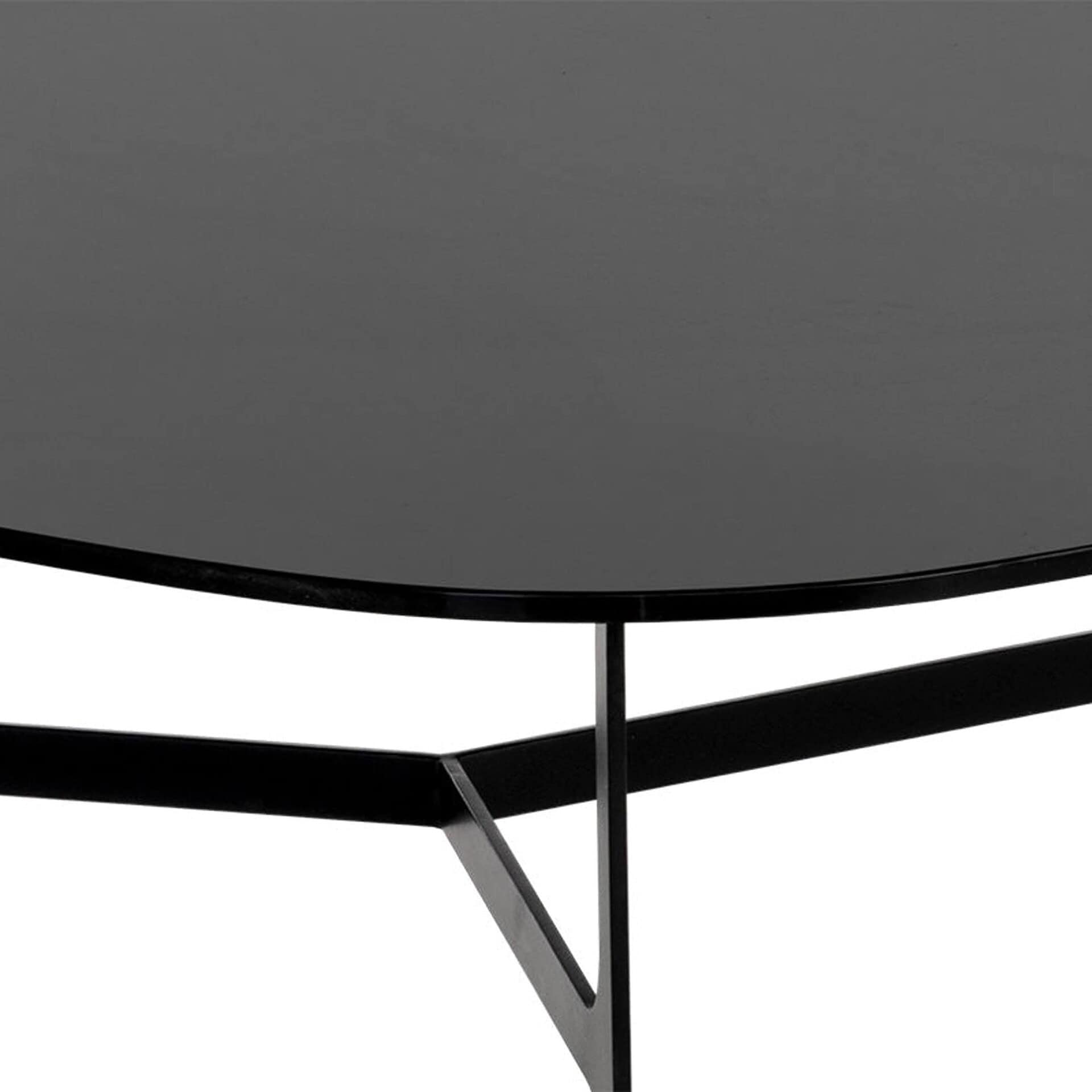 Black metal modern coffee table with sleek geometric legs and a round top.