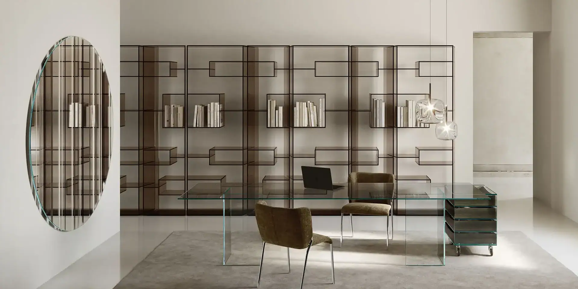 Sklar Furnishings glass desk with metal frame in contemporary office space.
