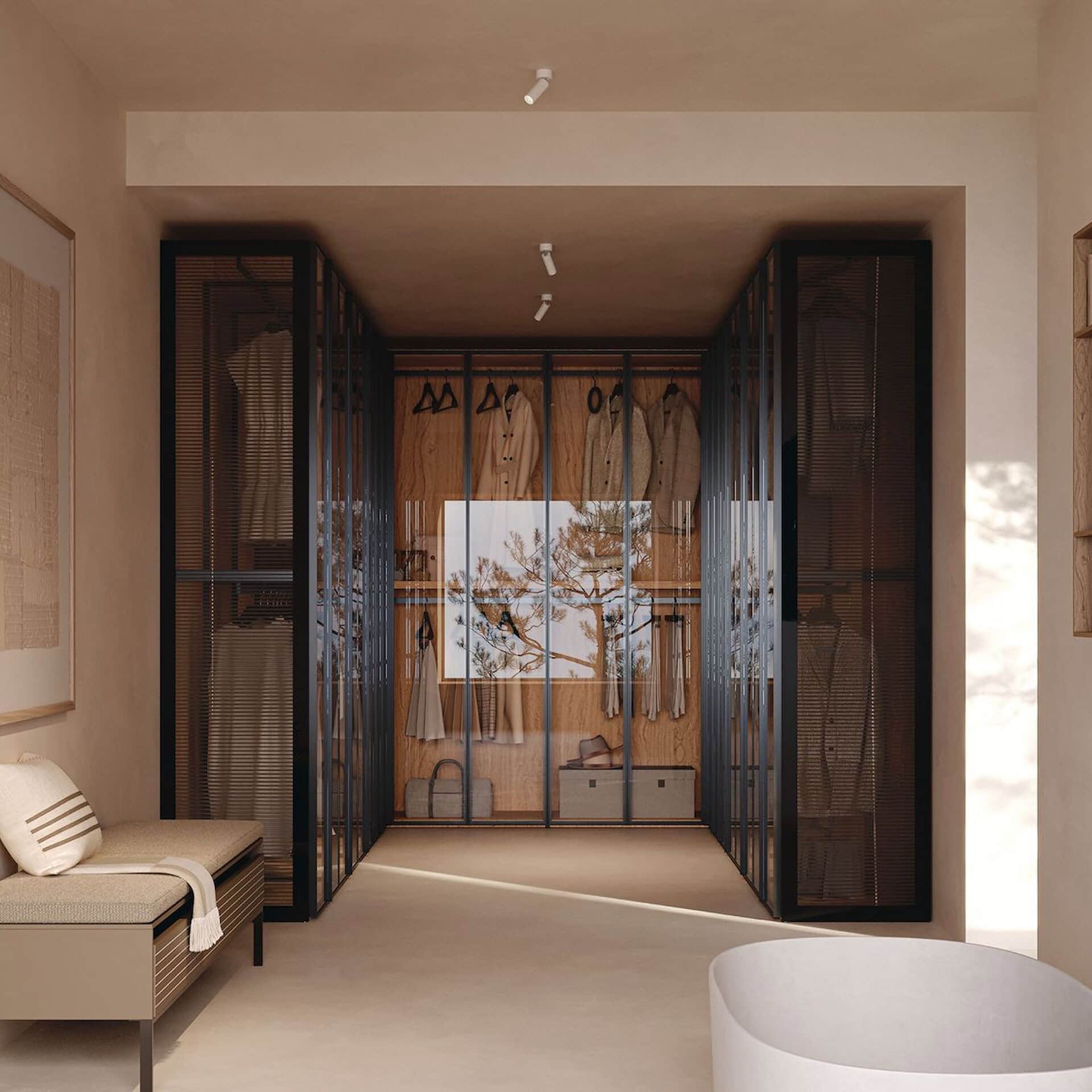 Elegant glass wardrobe system with black framing for modern bedrooms.