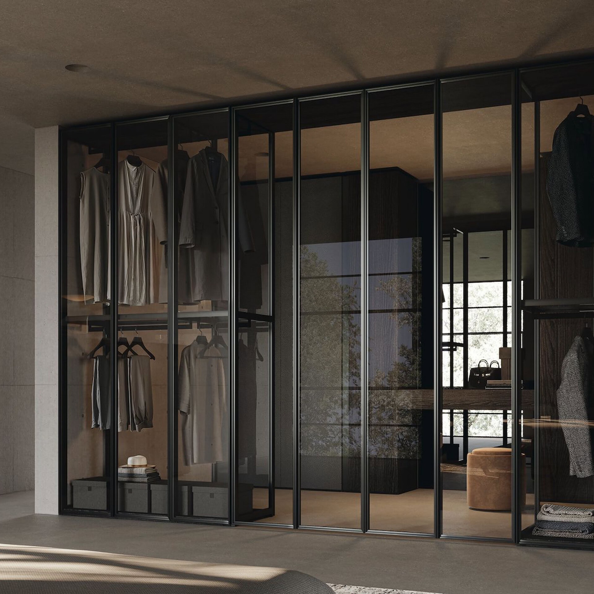 Glass wardrobe system with sleek black framing for stylish storage solutions.