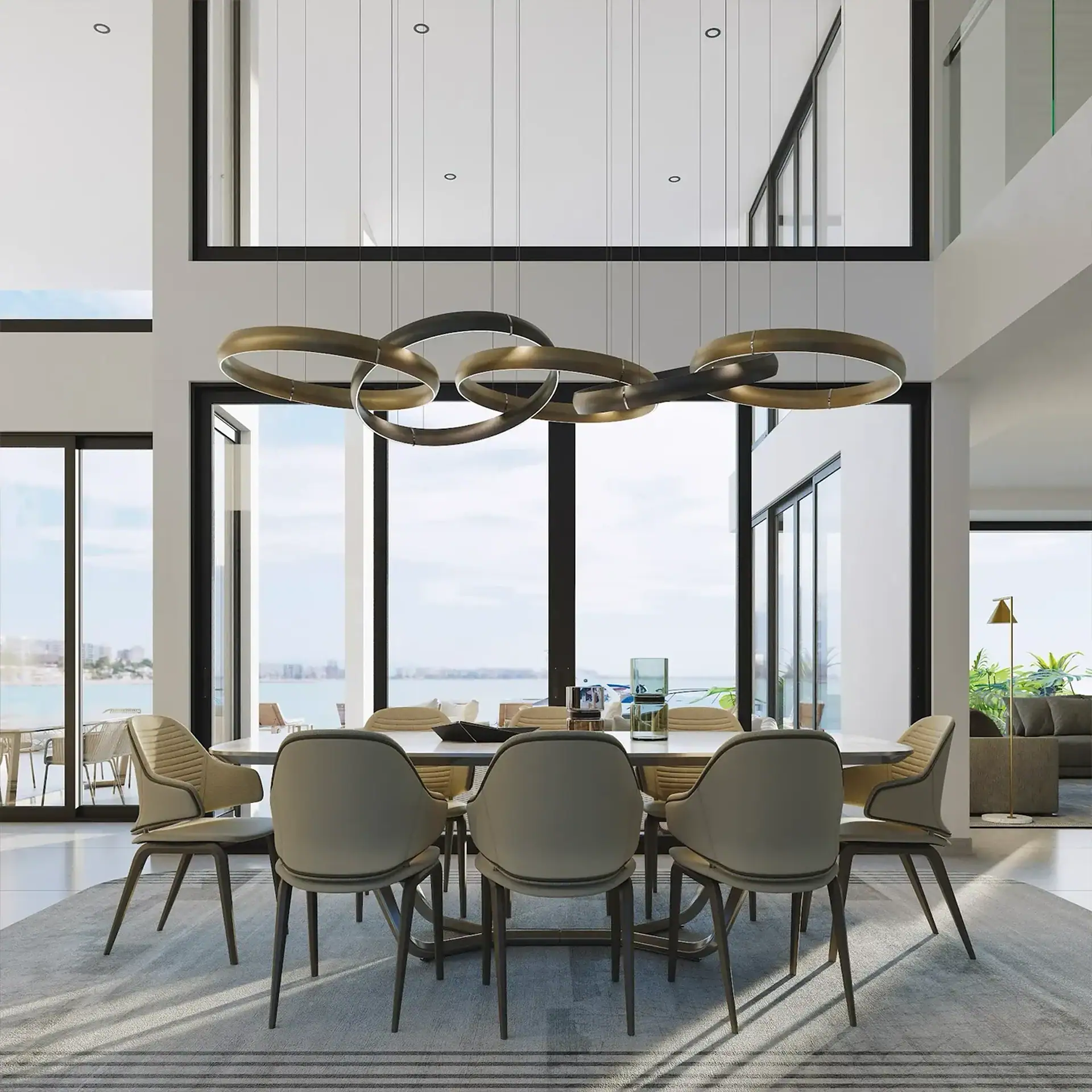Contemporary dining room featuring a sleek chandelier, large windows, and stylish chairs in a spacio.