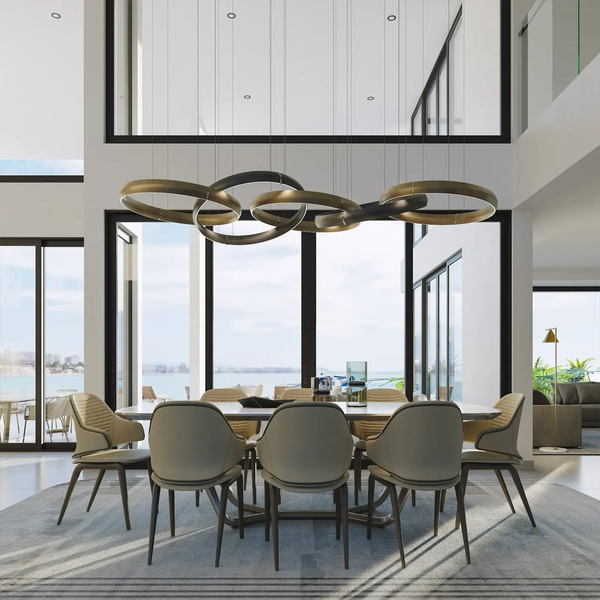 Contemporary dining room featuring a sleek chandelier, large windows, and stylish chairs in a spacio.